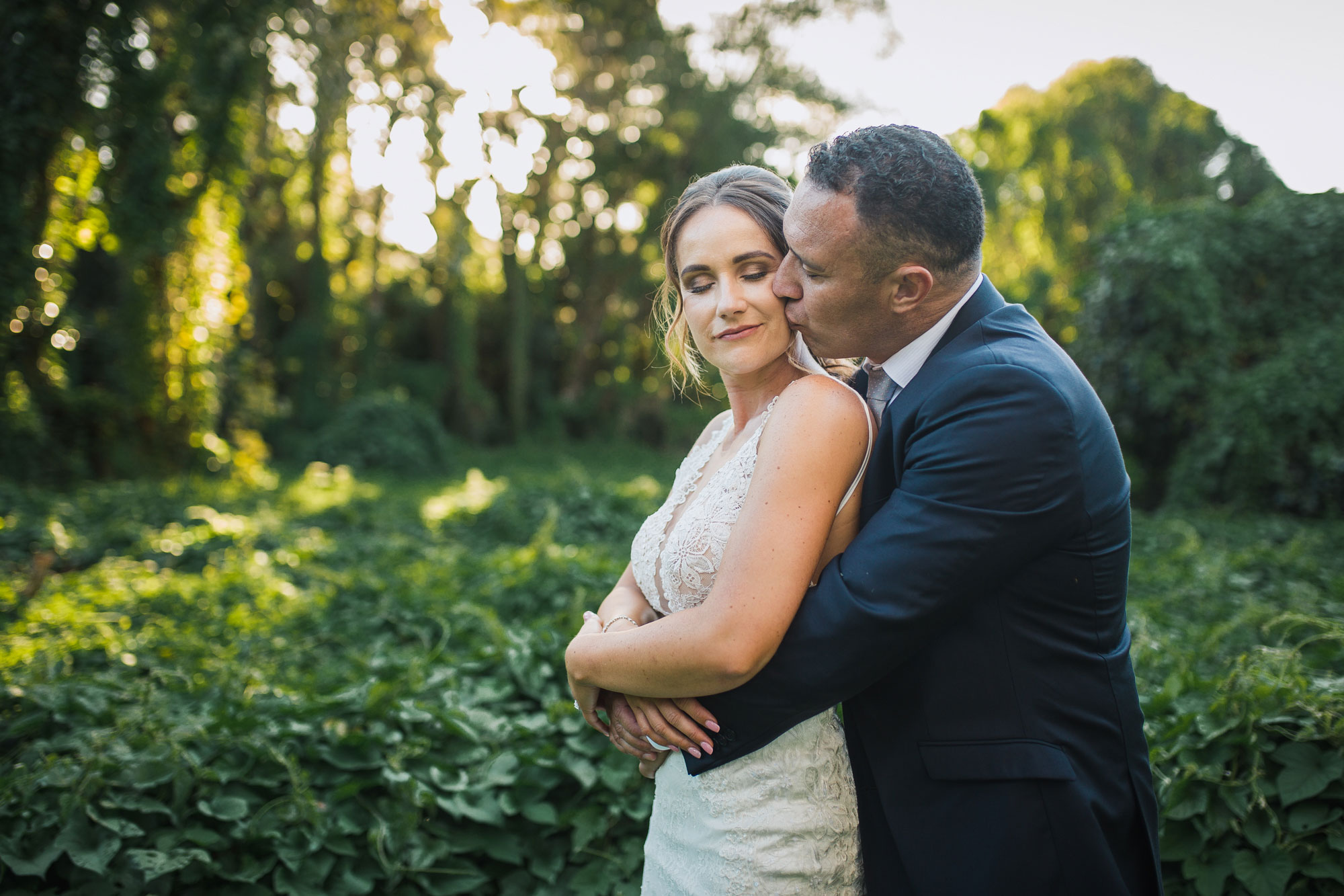 bride and groom embrace