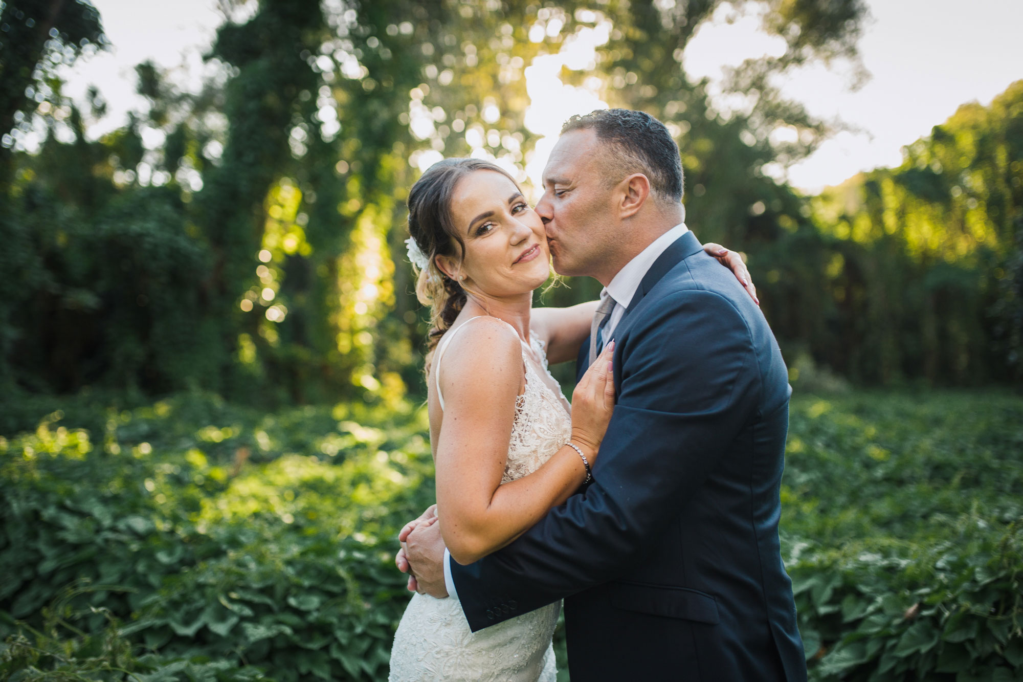 groom kissing the bride