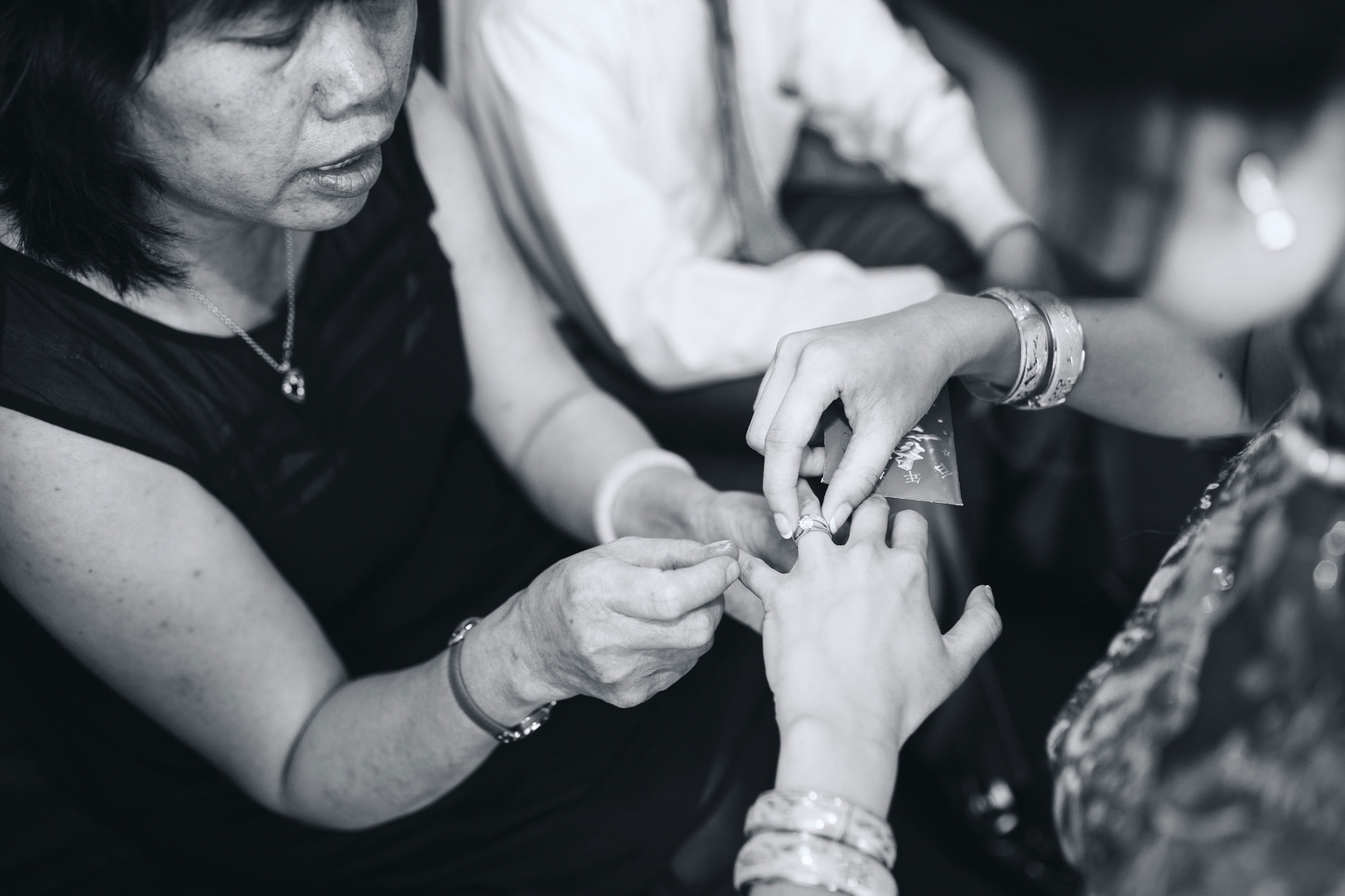 bride putting on jewellery