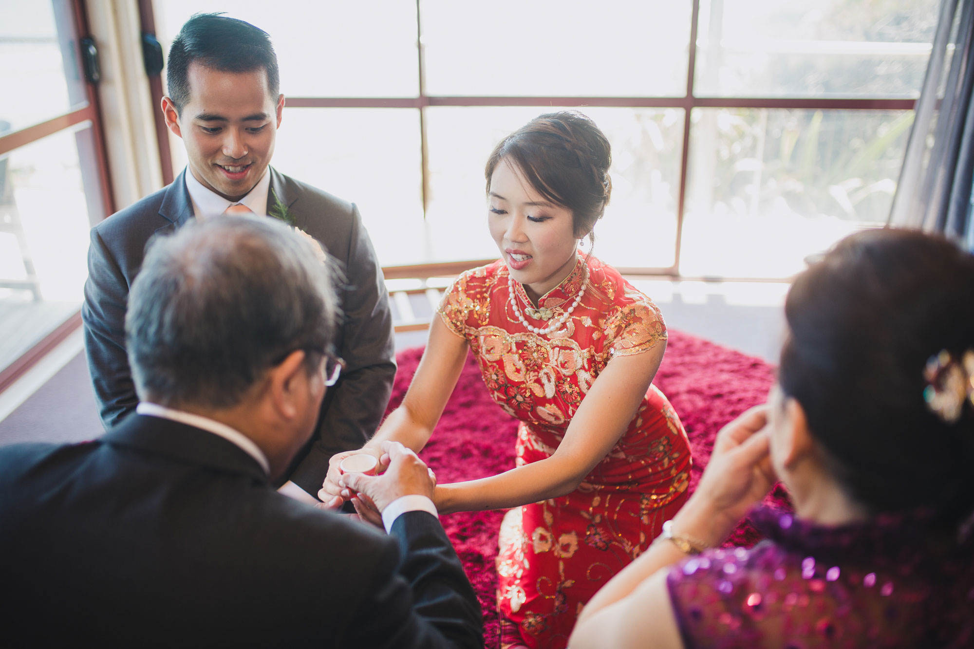 bride serving tea to parents