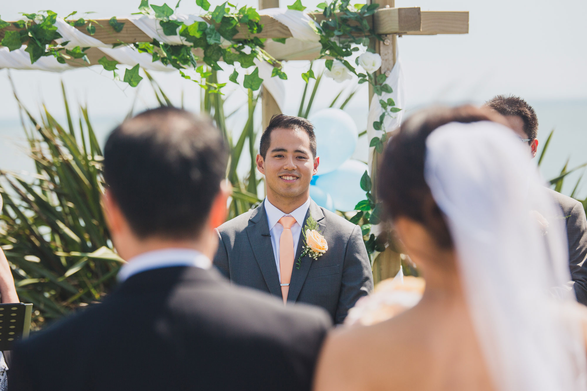 groom looking at bride