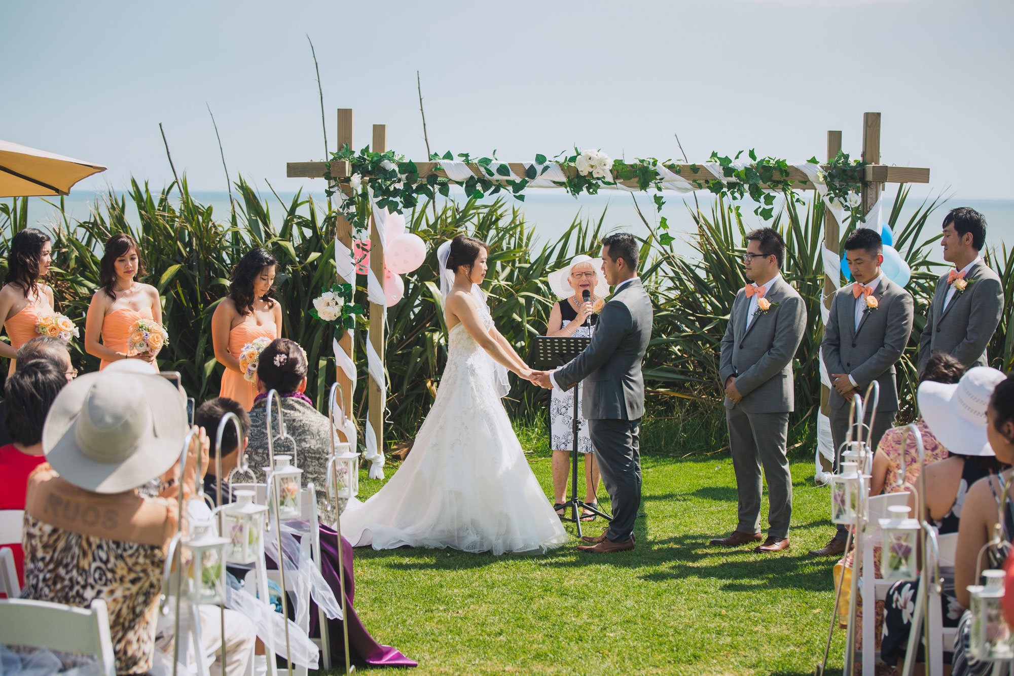 bride and groom holding hands