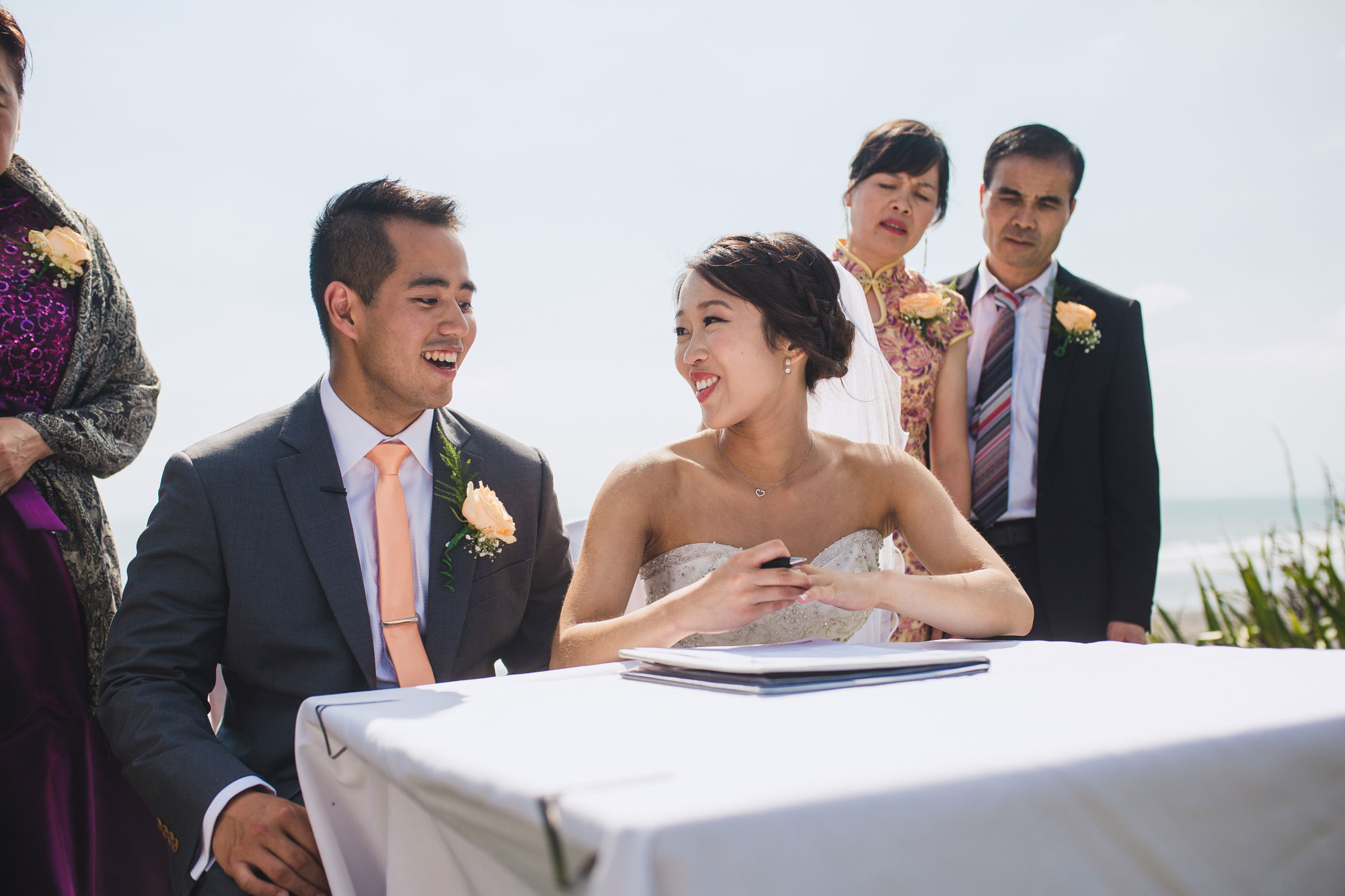 bride and groom signing