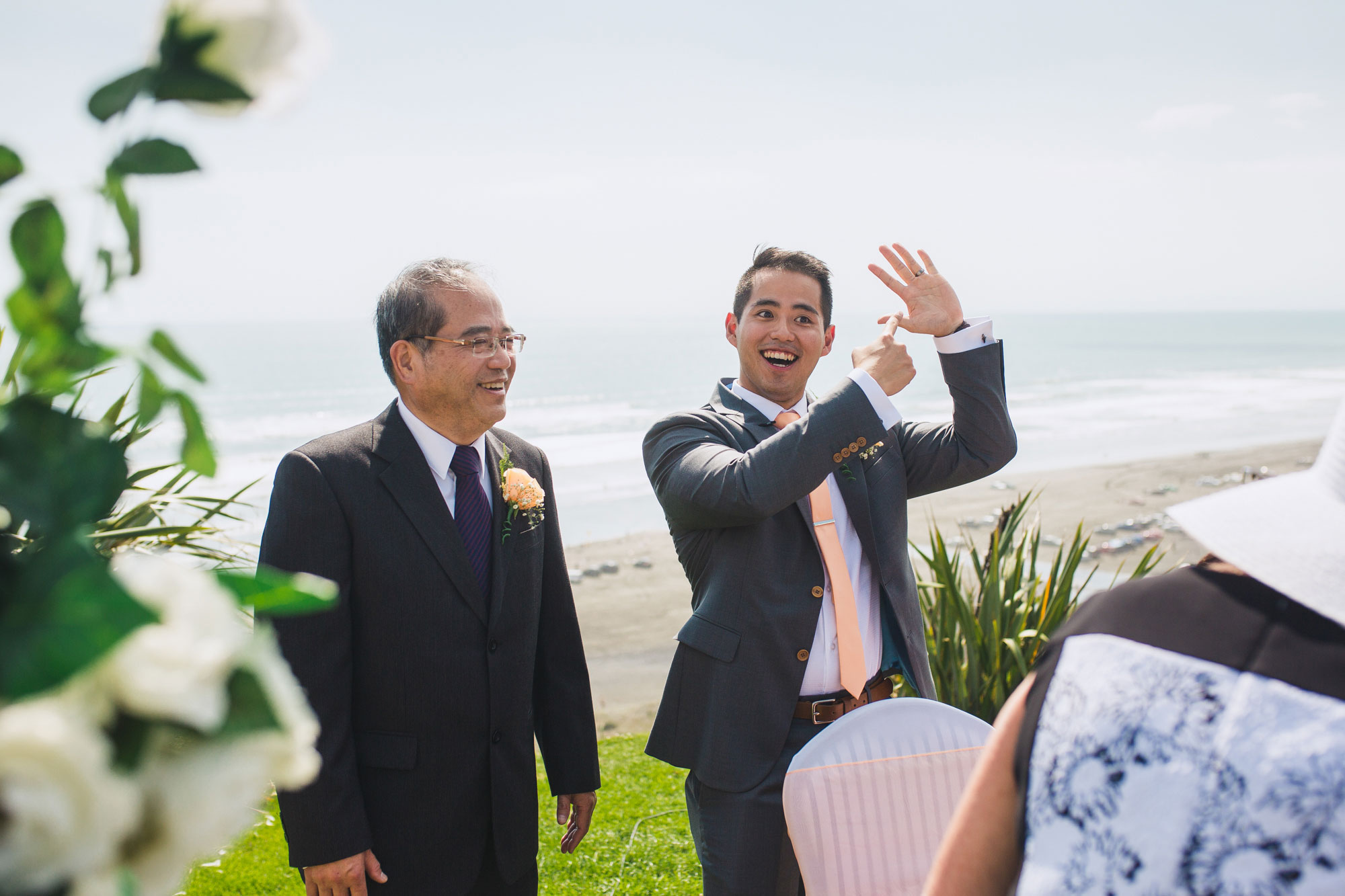 groom pointing at ring