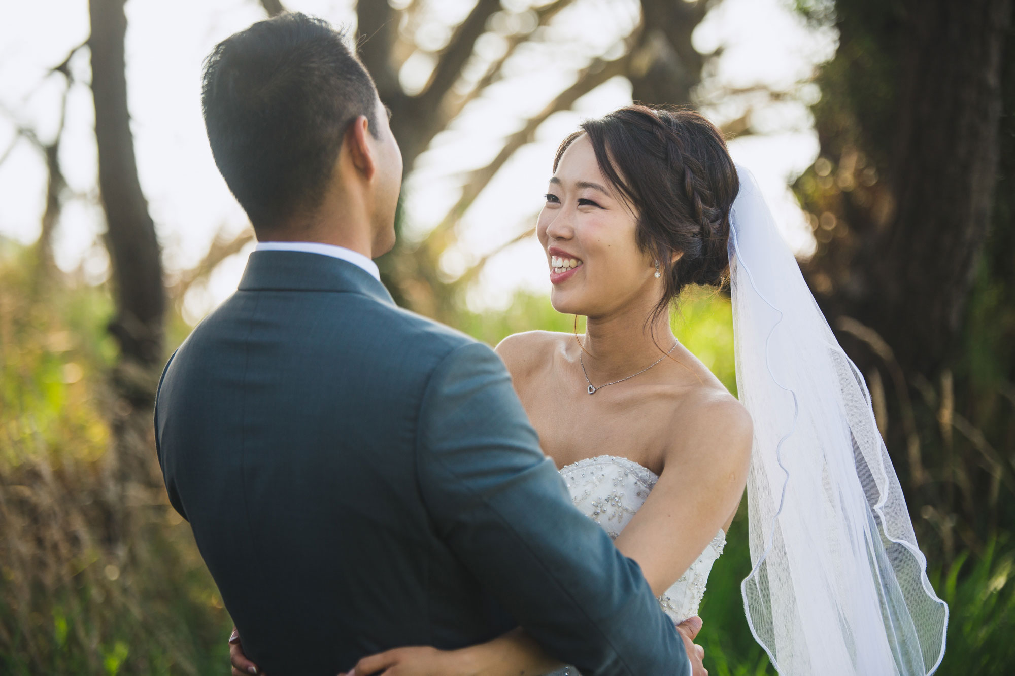 bride and groom laughing