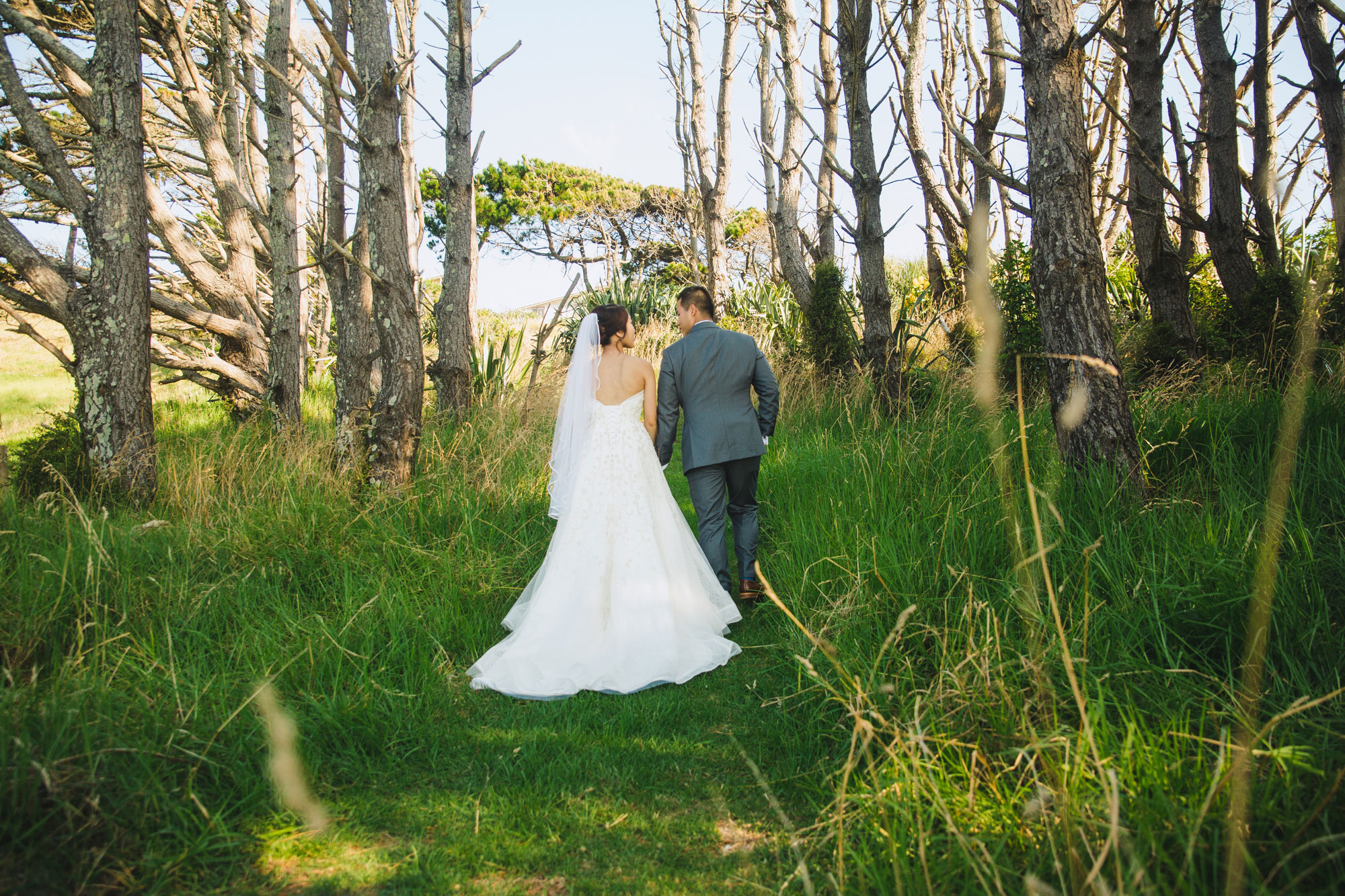 bride and groom walking away