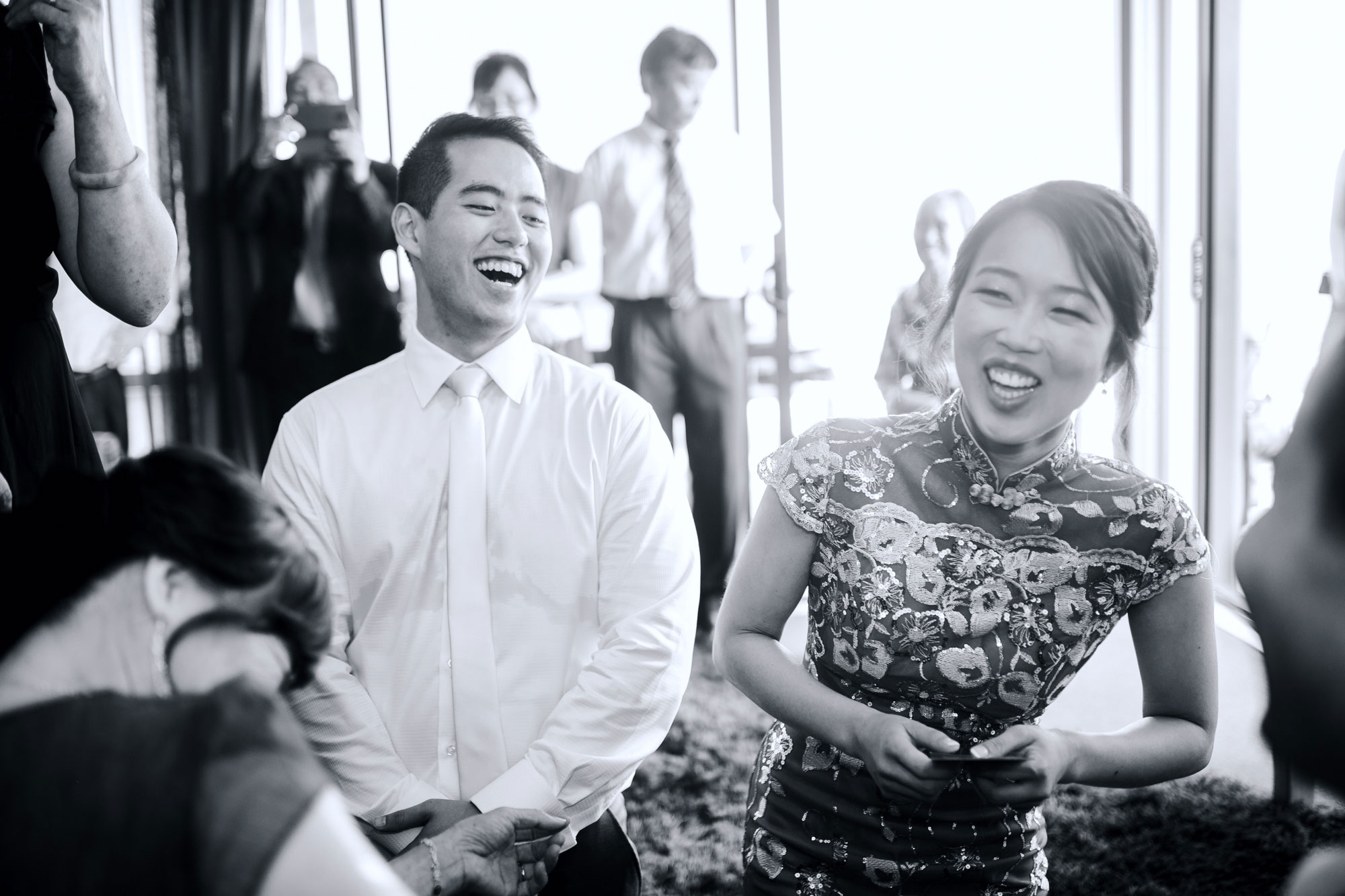 bride and groom laughing