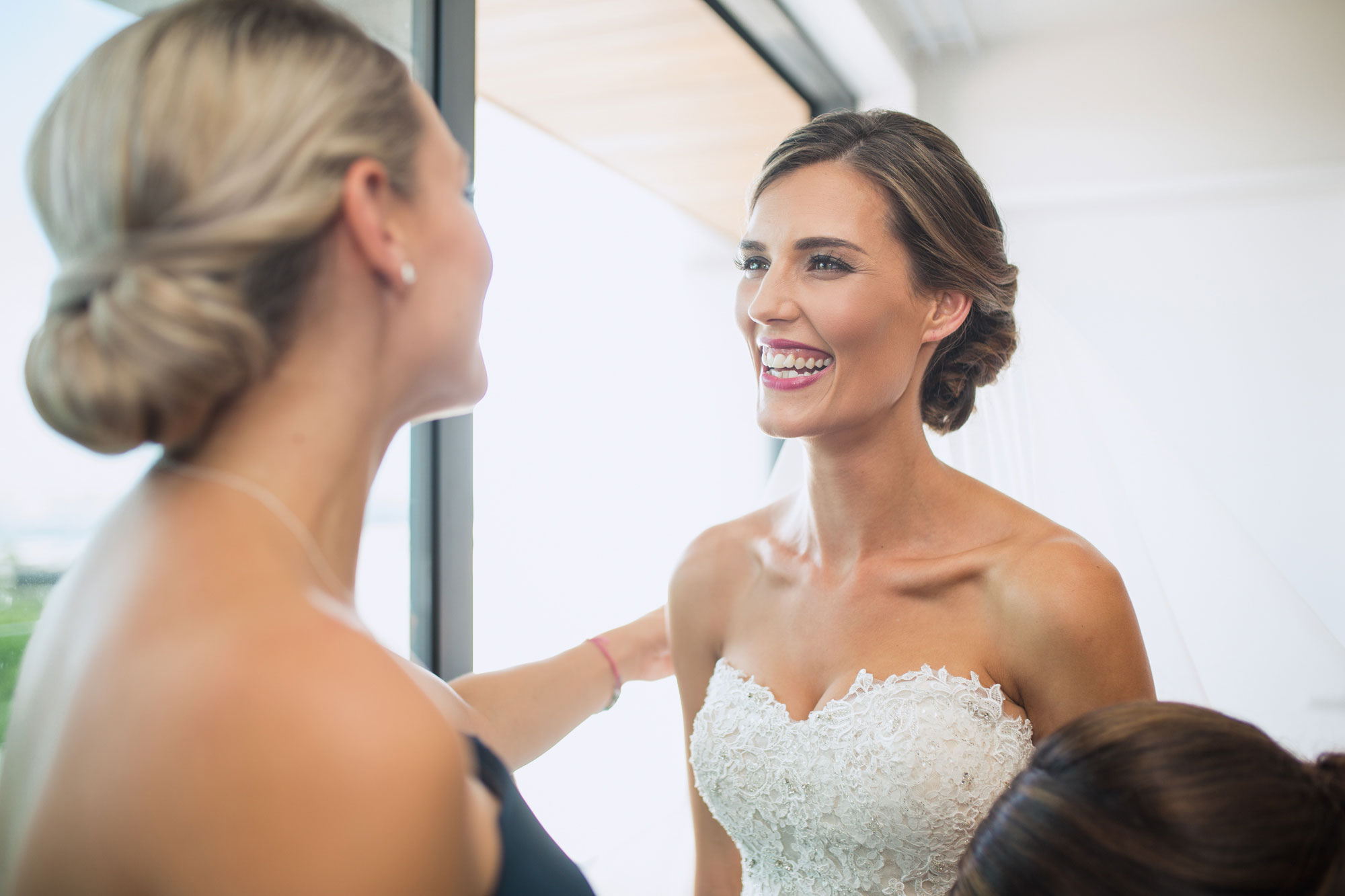 bride smiling at the girls