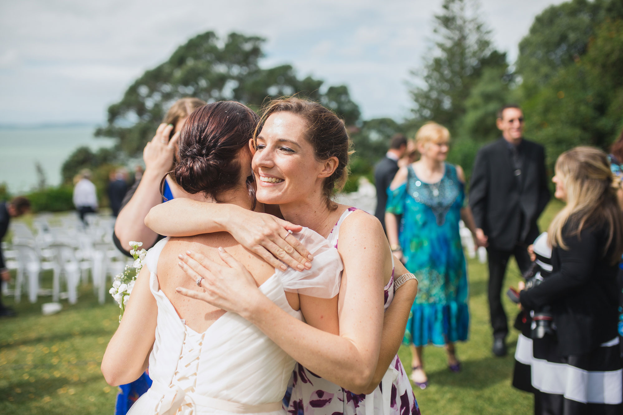 wedding guest hugging bride