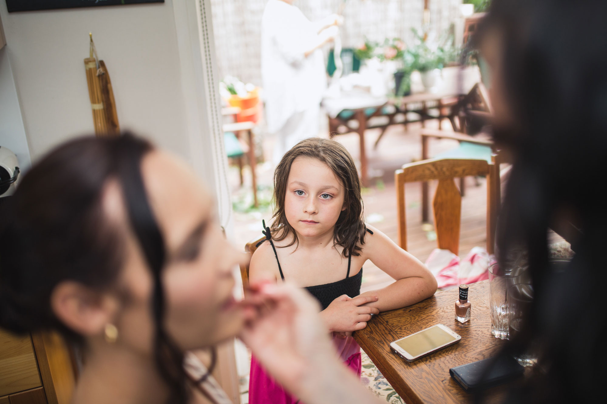 flower girl looking at bride