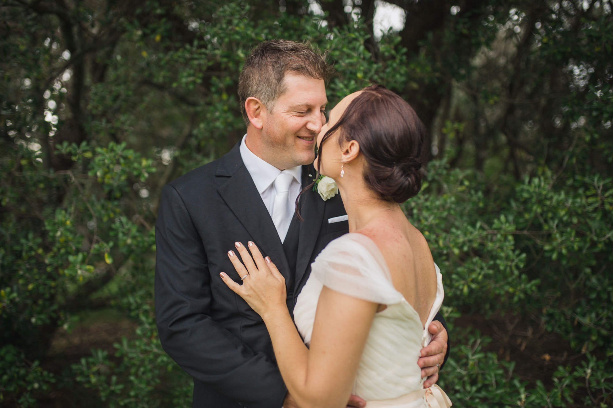 groom kissing bride