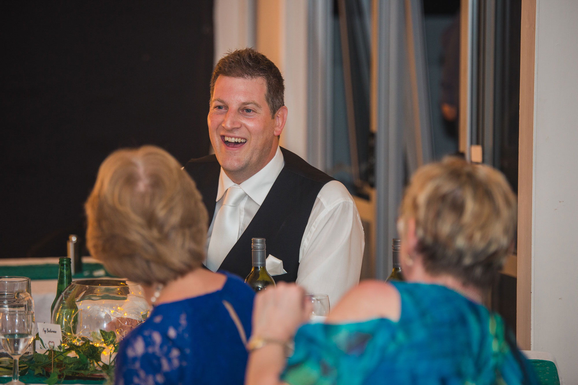 groom chatting with guests