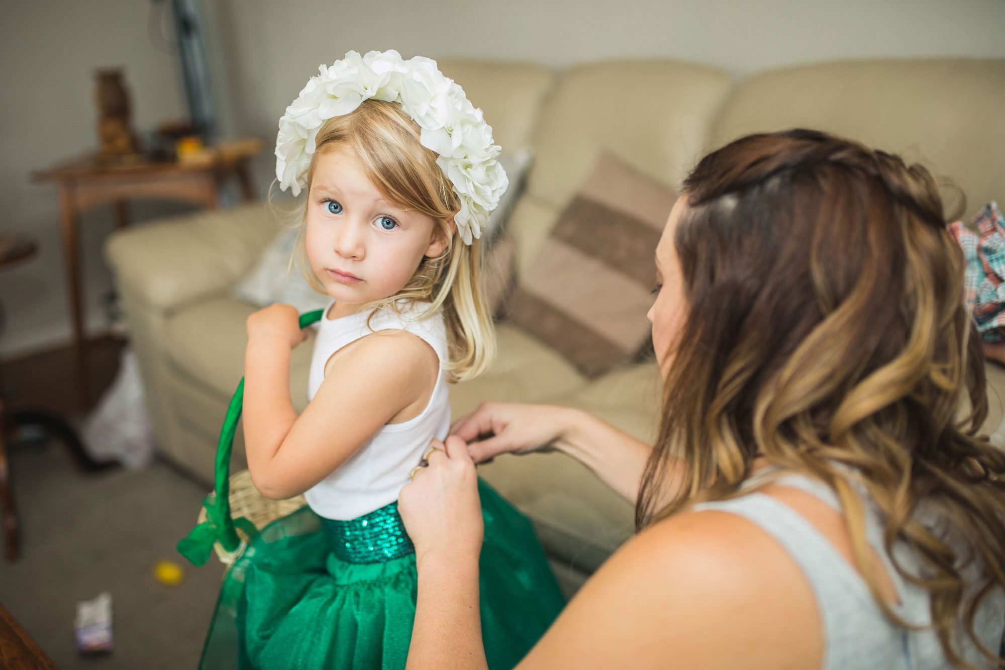 flower girl getting dressed