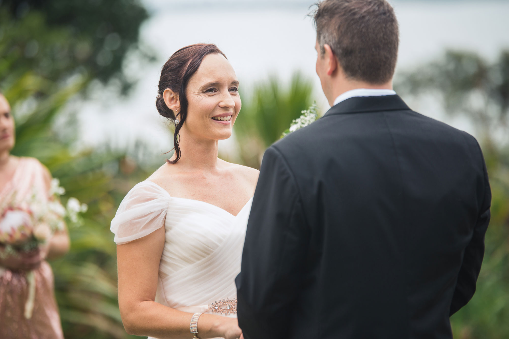 bride smiling at the groom