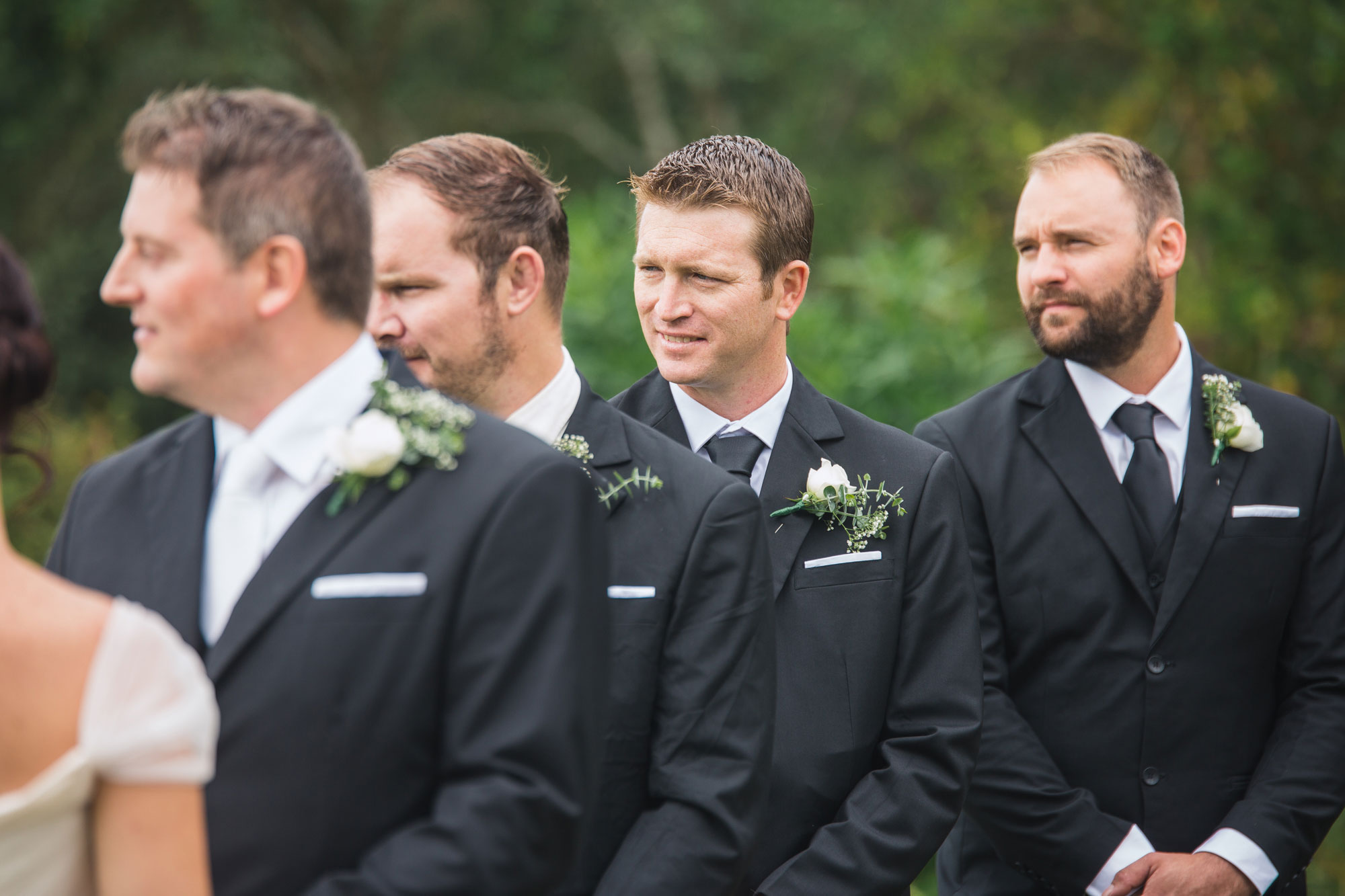 groomsmen smiling