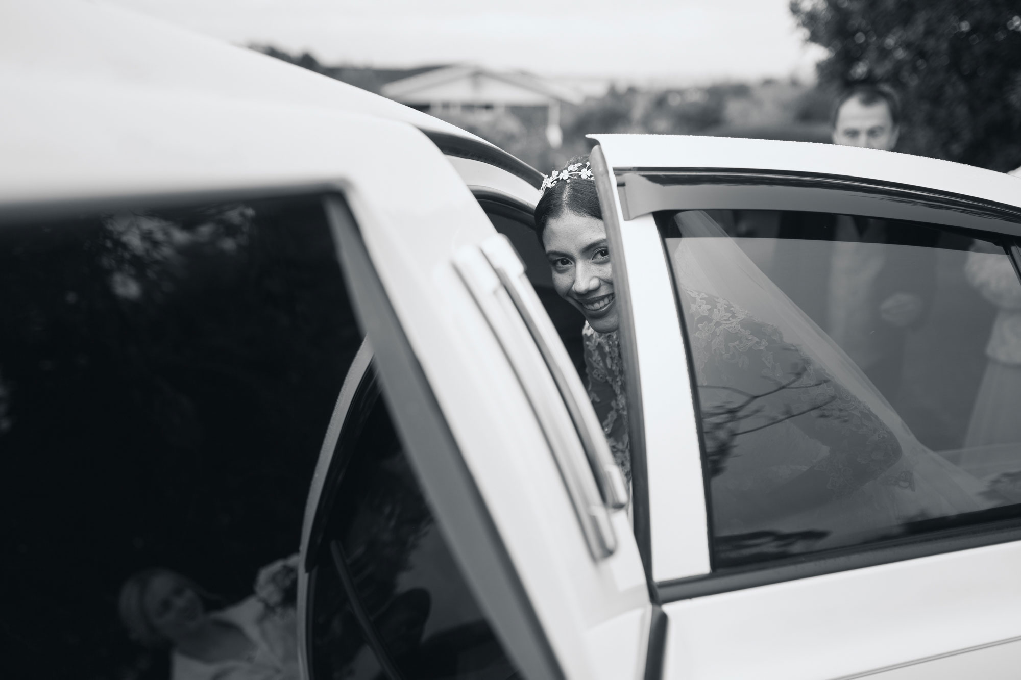 bride getting into wedding car