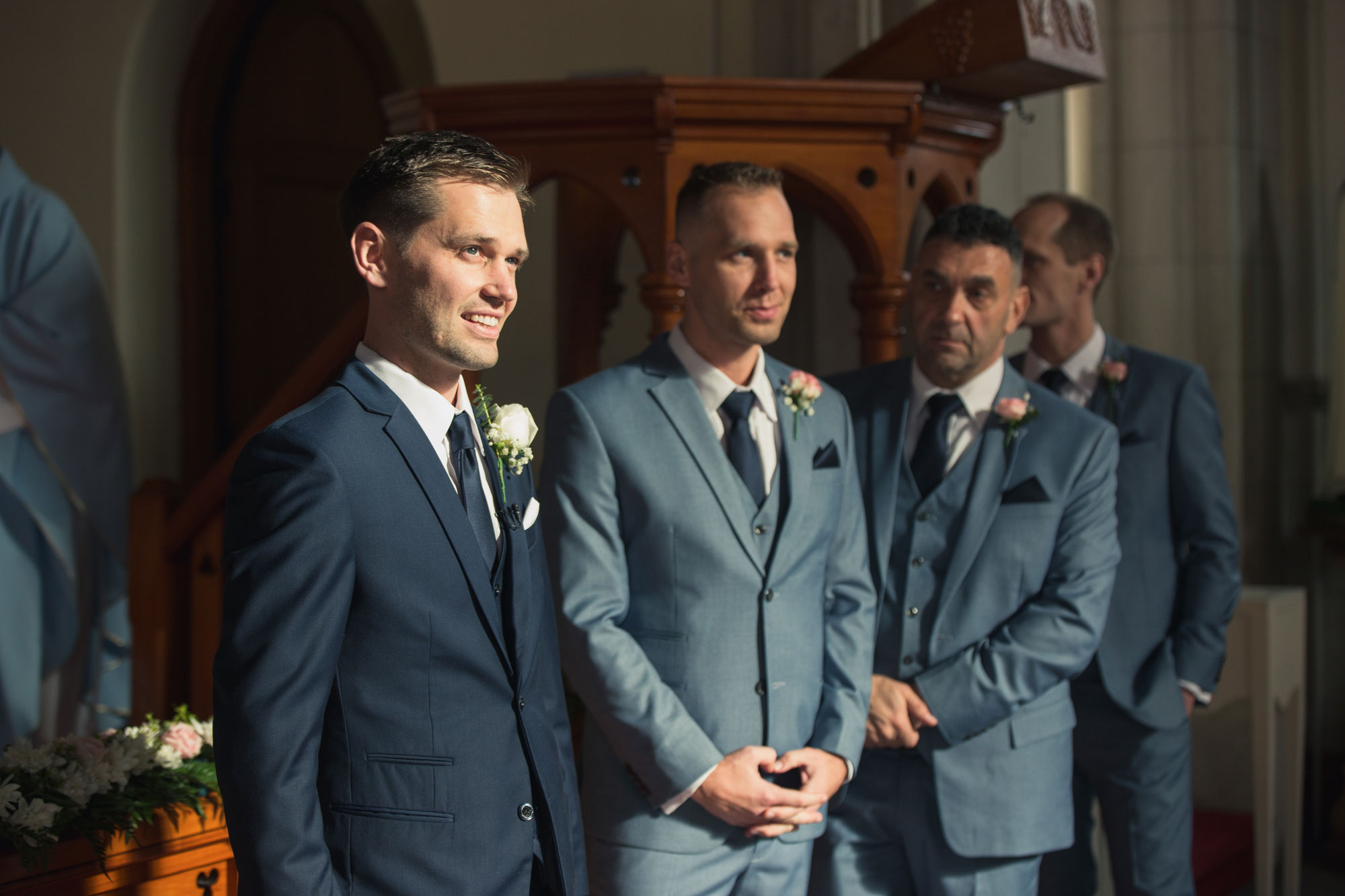 groom and groomsmen waiting for the bride