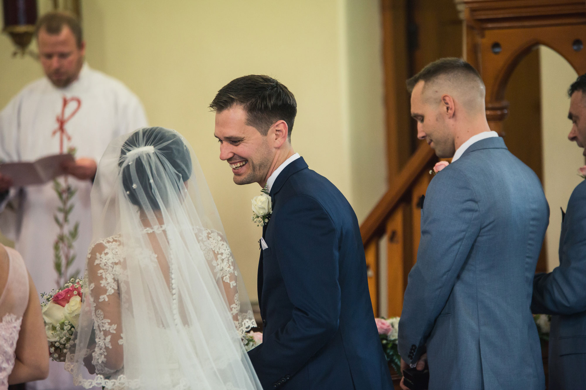 groom whispering to the bride