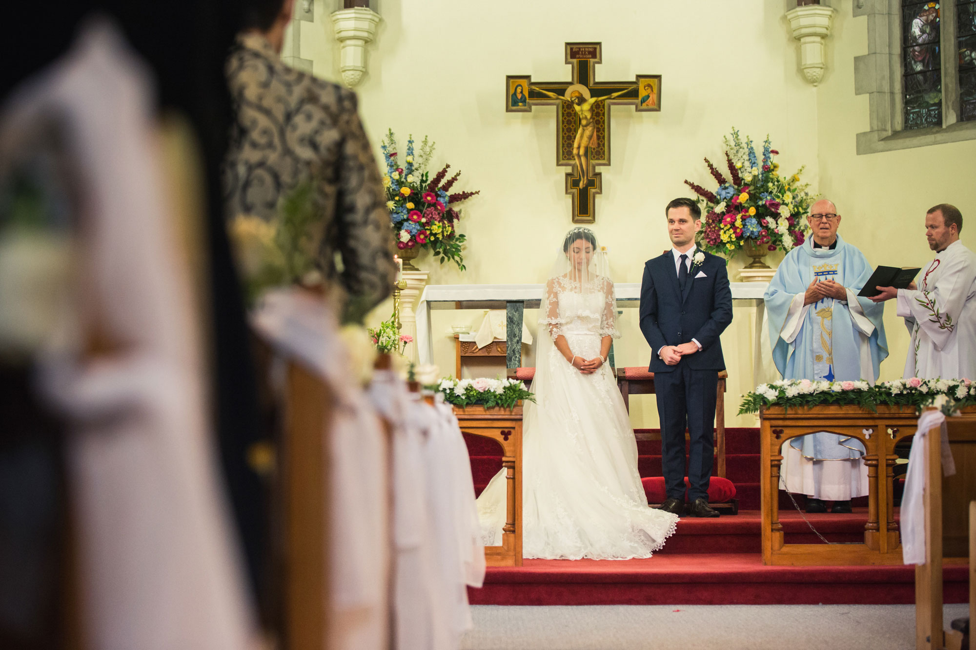 bride and groom at altar