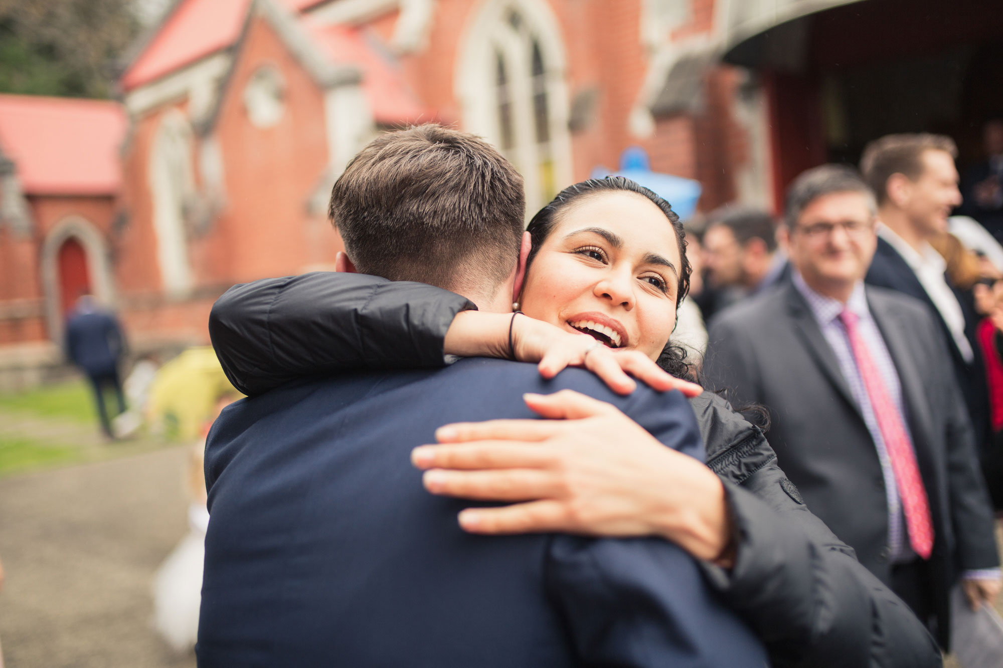 wedding guests hugging