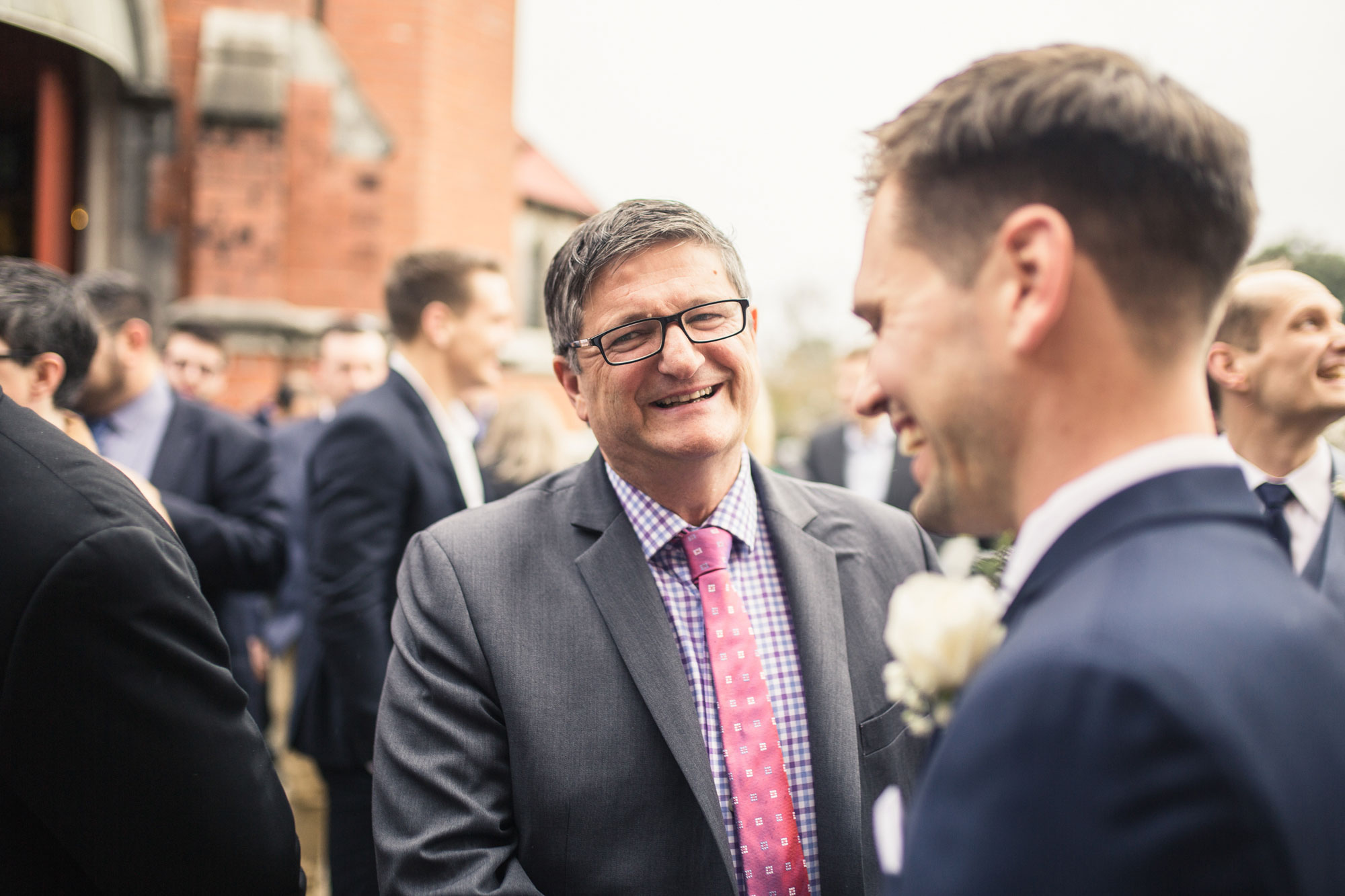 wedding guest smiling