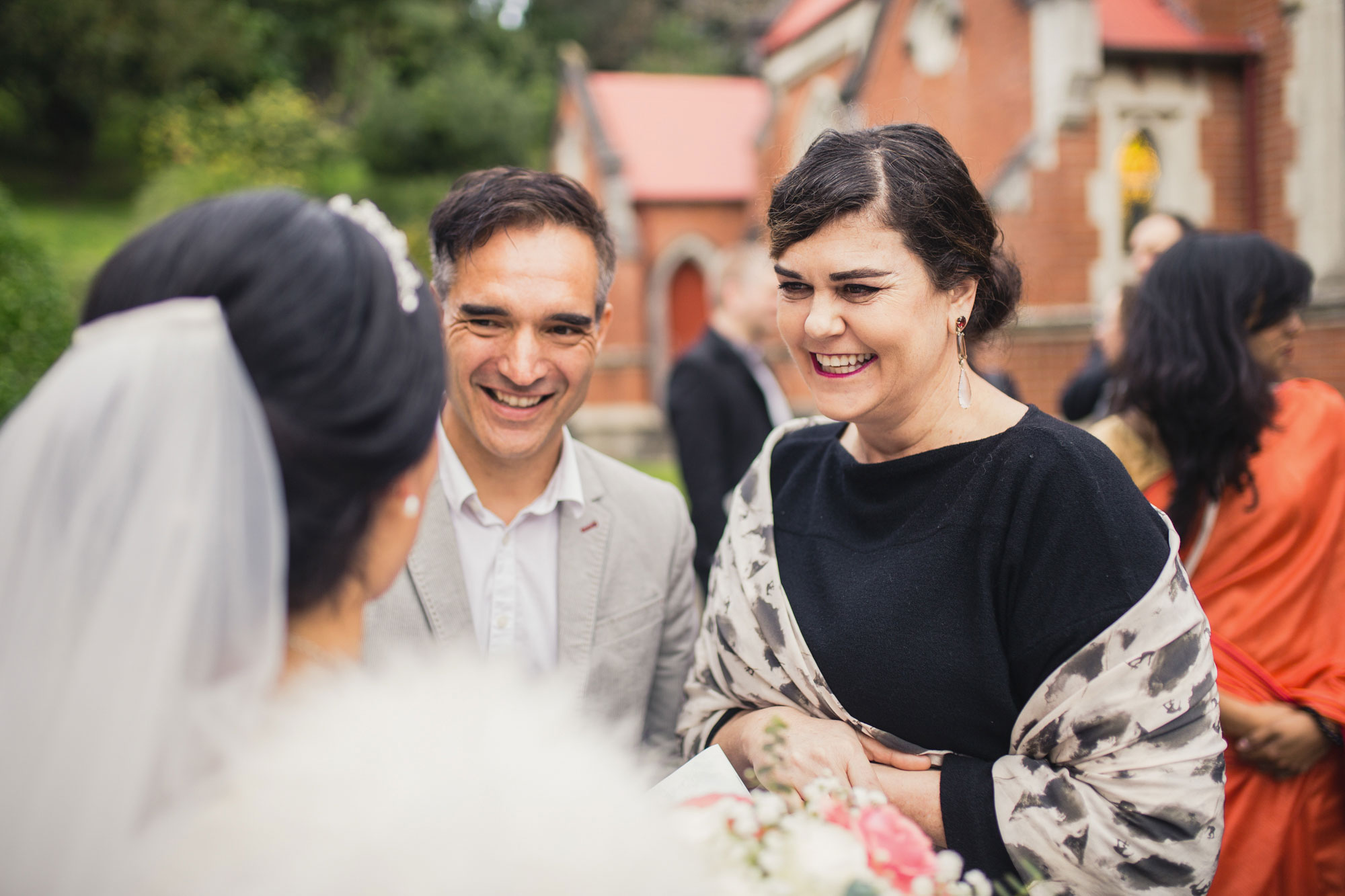 guests smiling at the bride