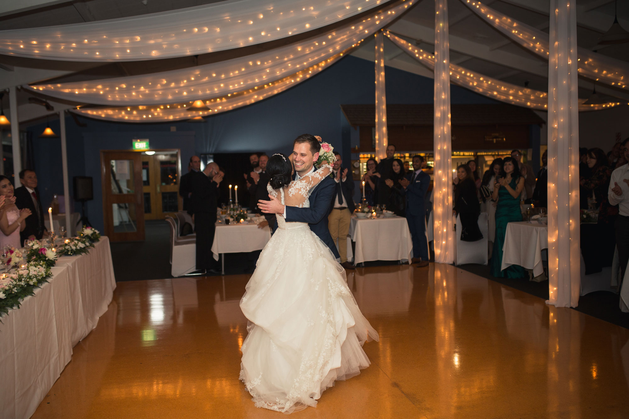 bride and groom embrace ponsonby cruising club