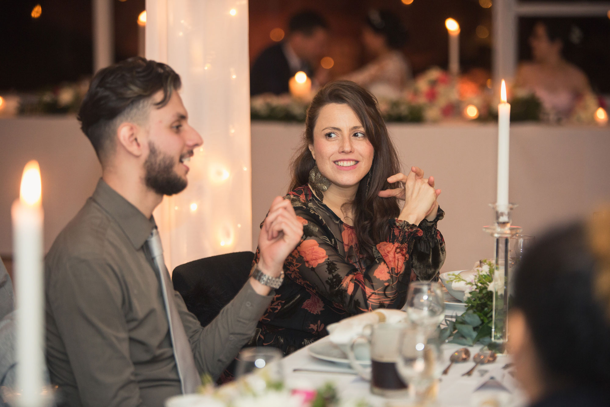 wedding guests chatting at reception