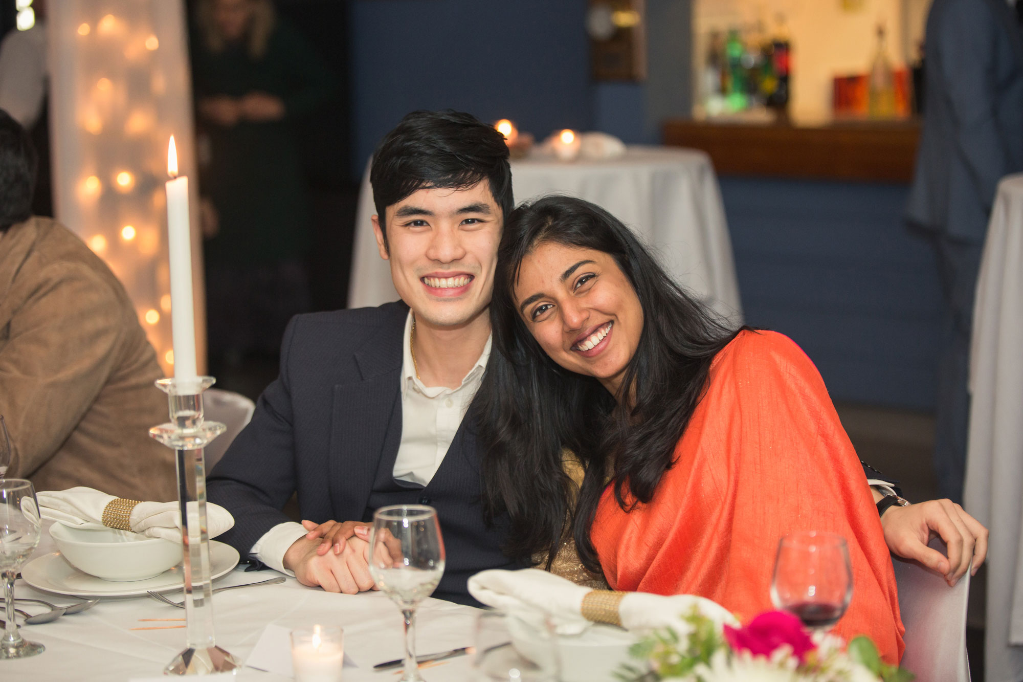 wedding guests smiling at camera