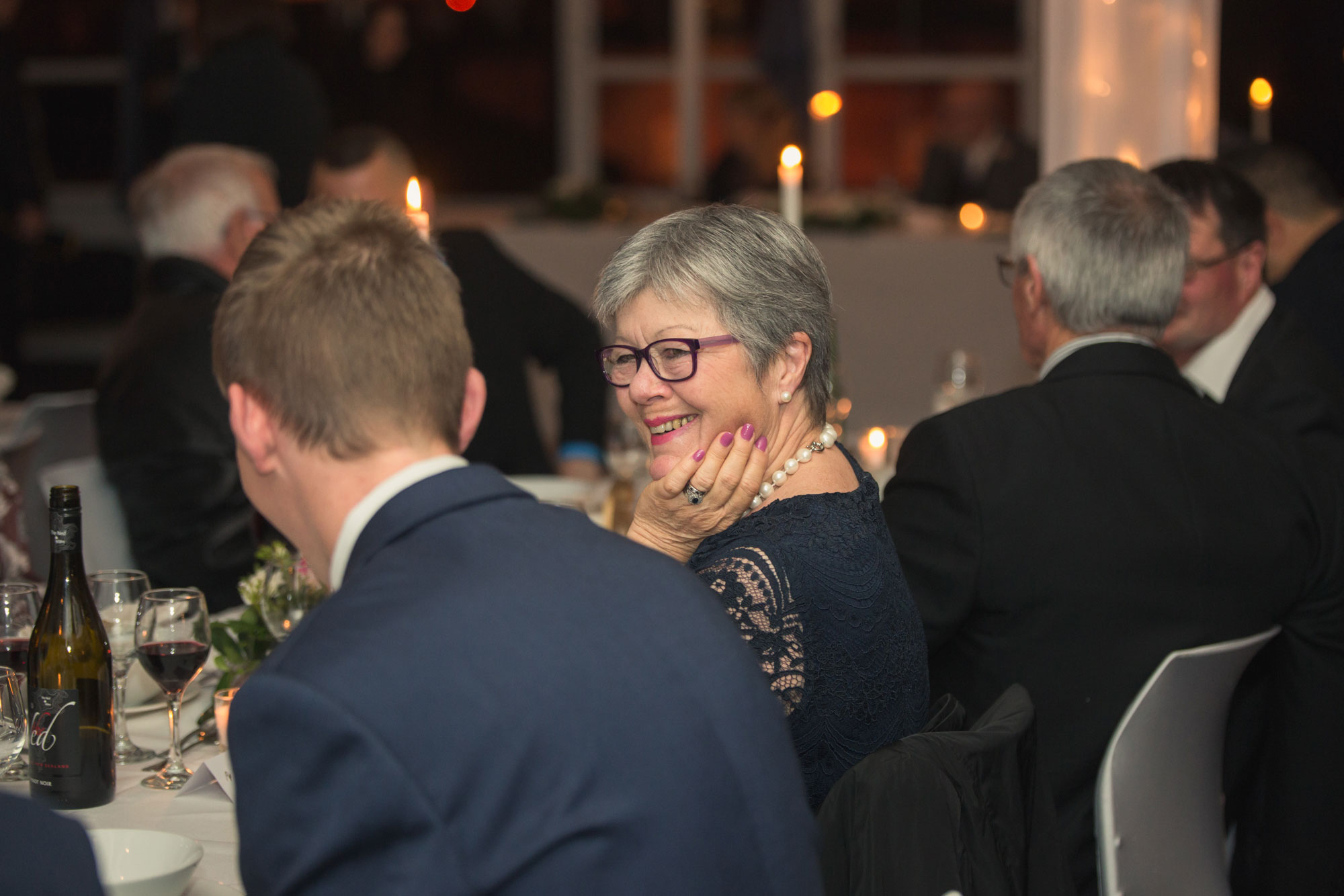 lady smiling at wedding reception