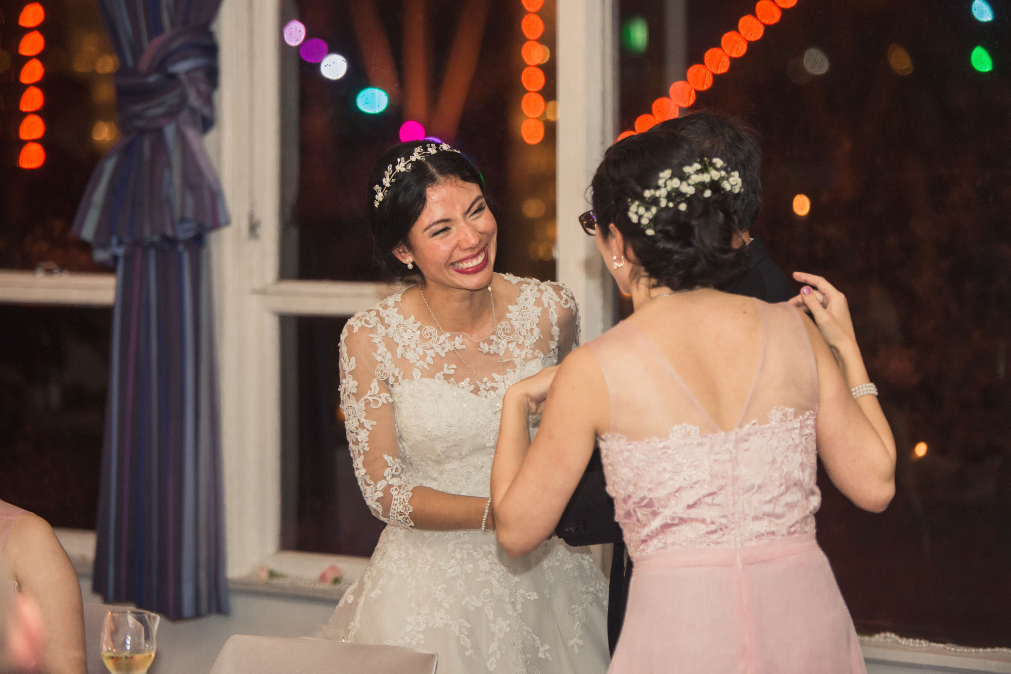 bride and her sister laughing