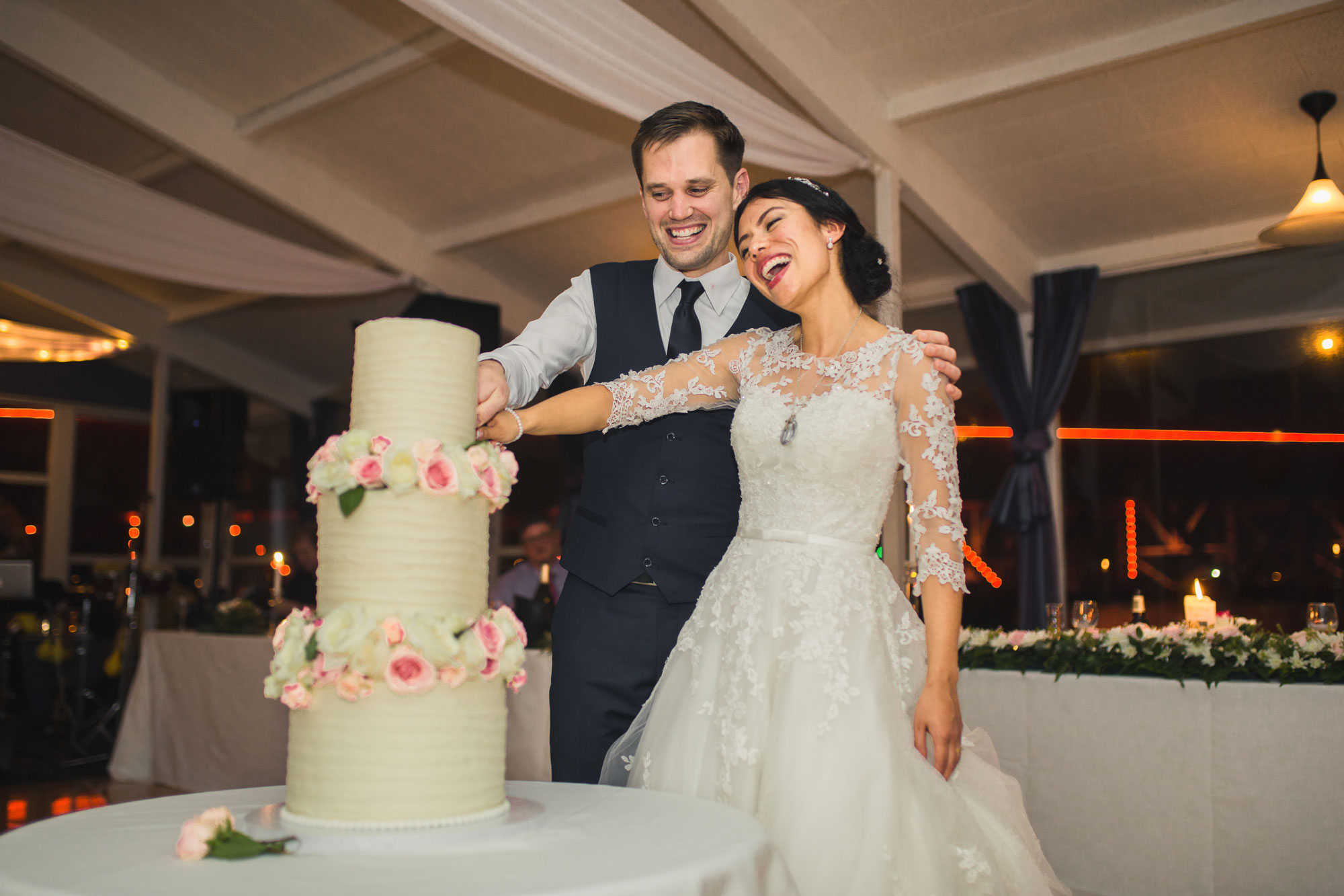 bride and groom cake cutting