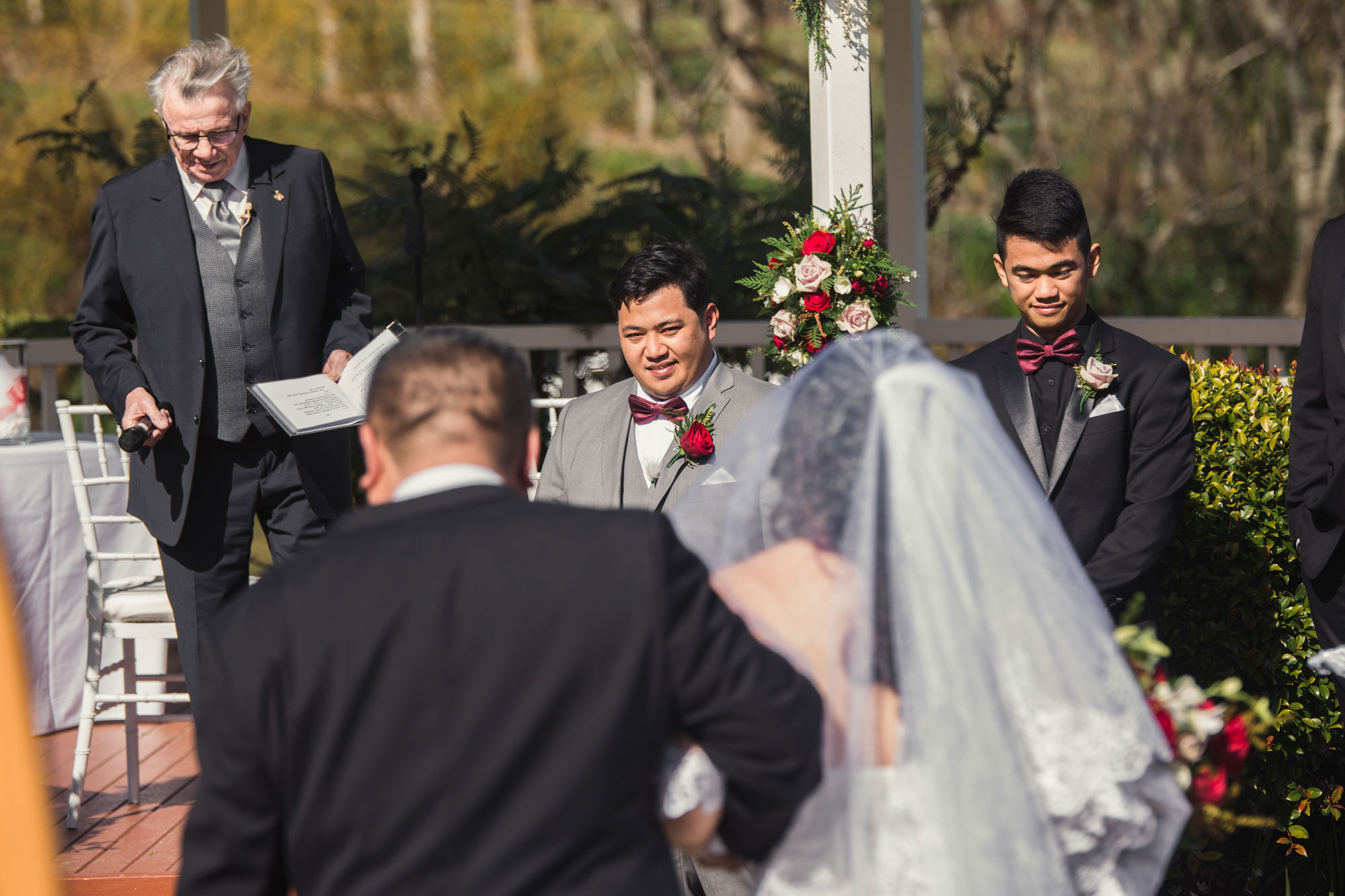 groom looking at the bride