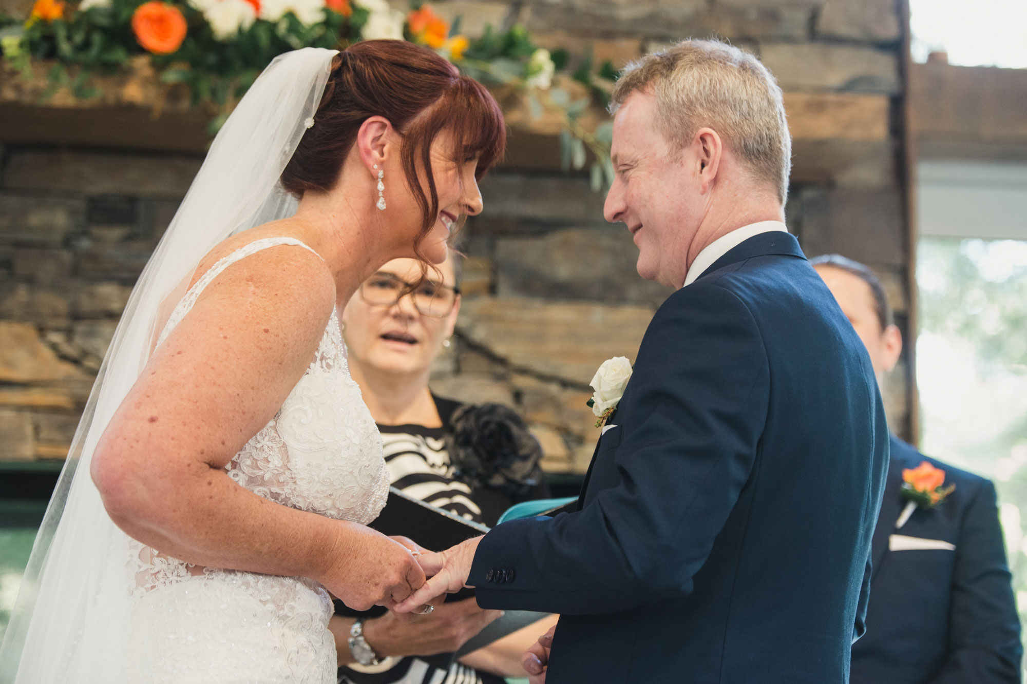 bride putting on ring