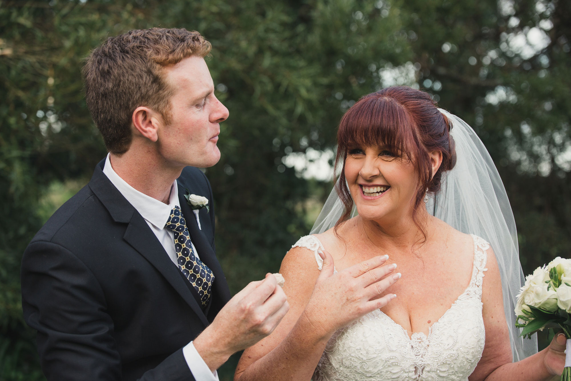 bride and son laughing