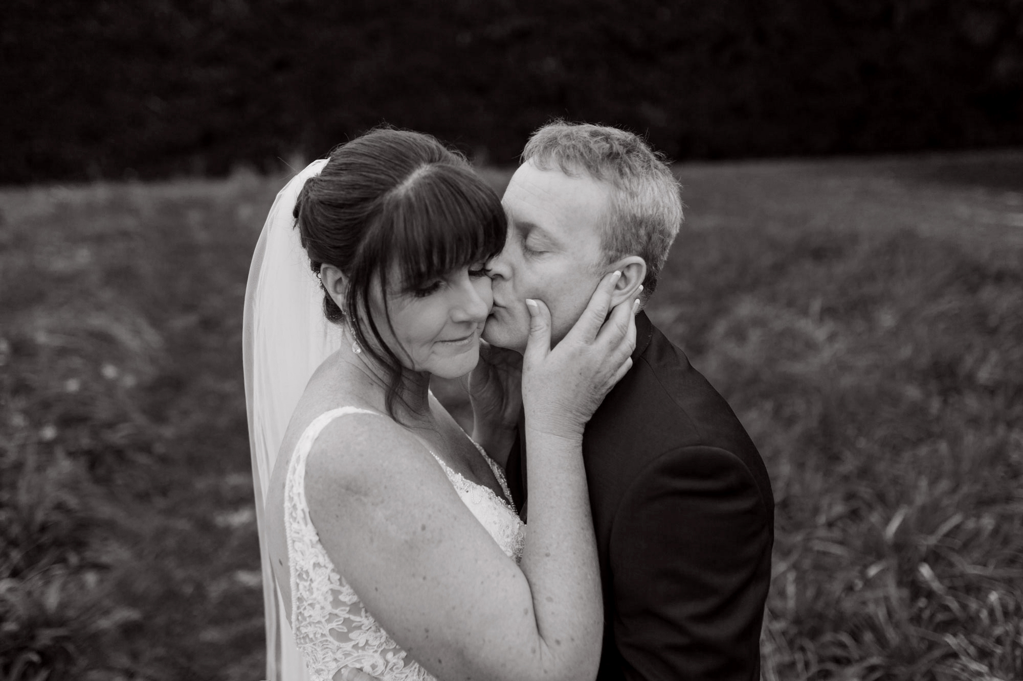 bride and groom embrace