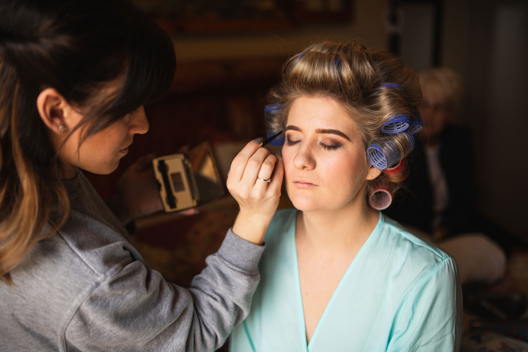 bride getting make up done