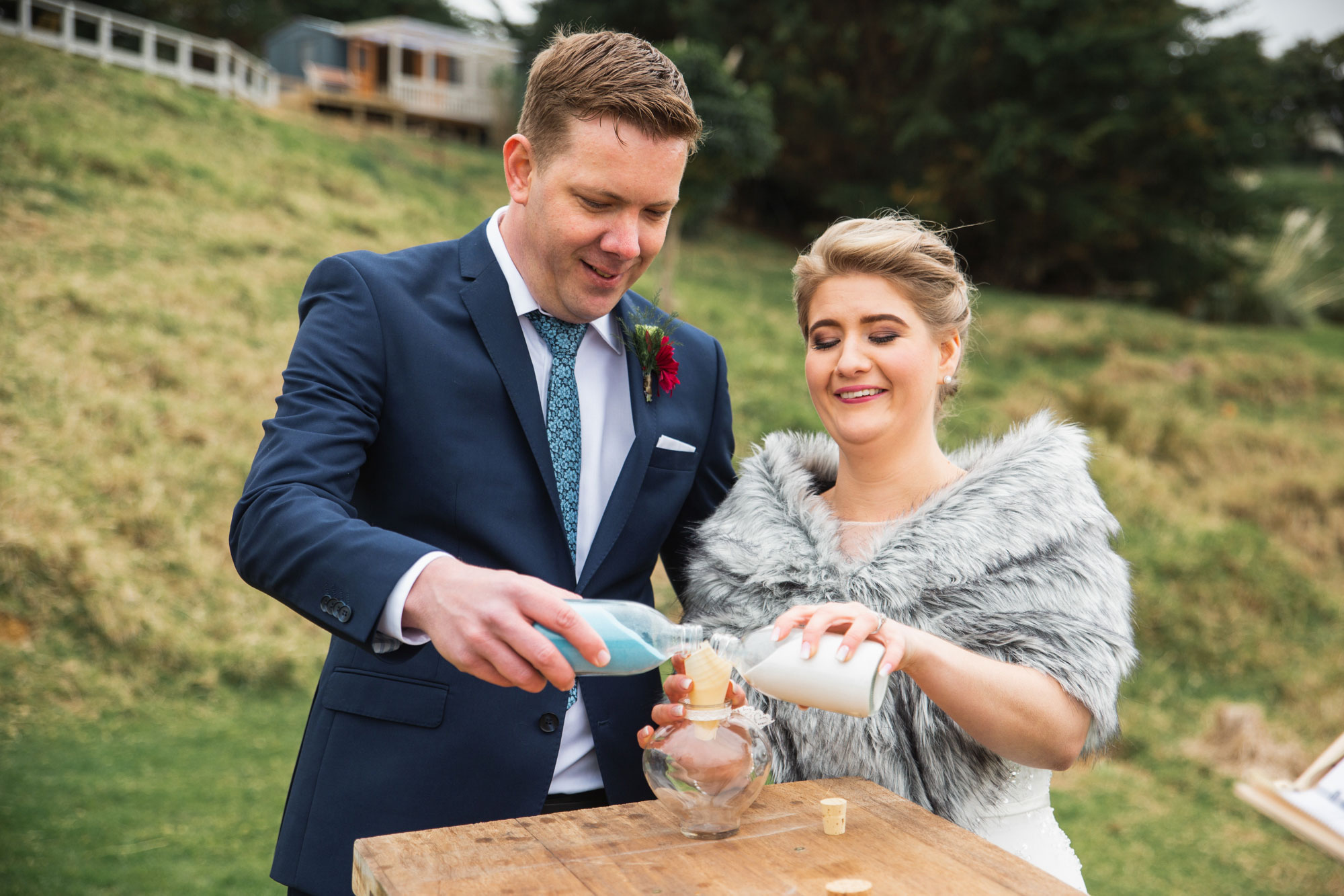 bride and groom sand