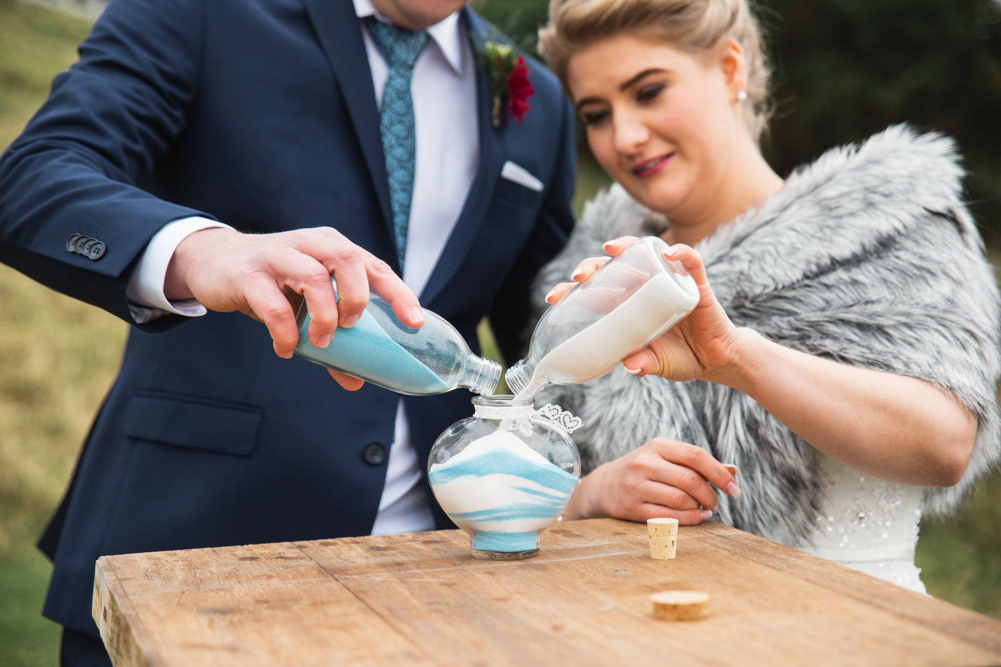bride and groom pouring sand