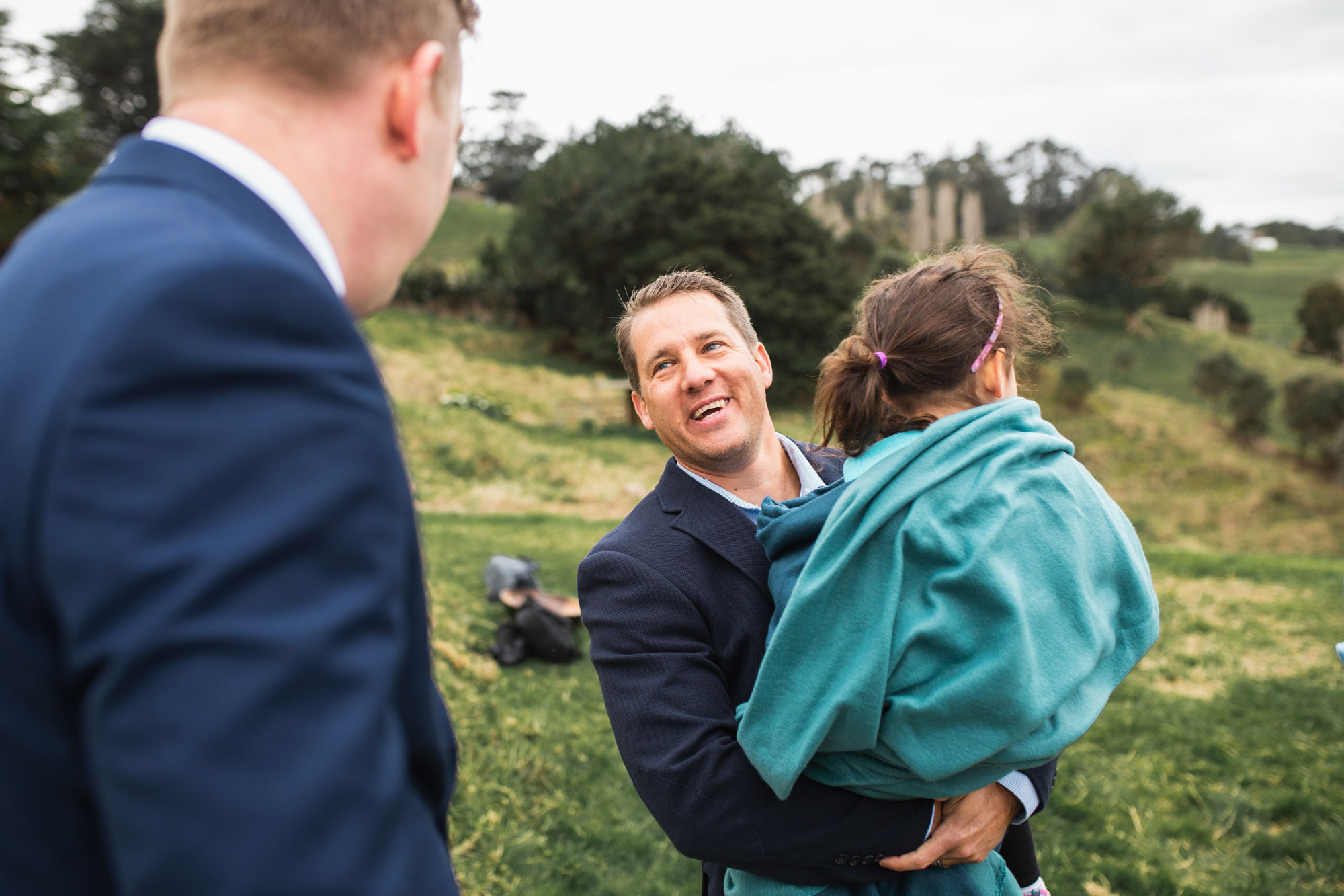 guest congratulating the groom