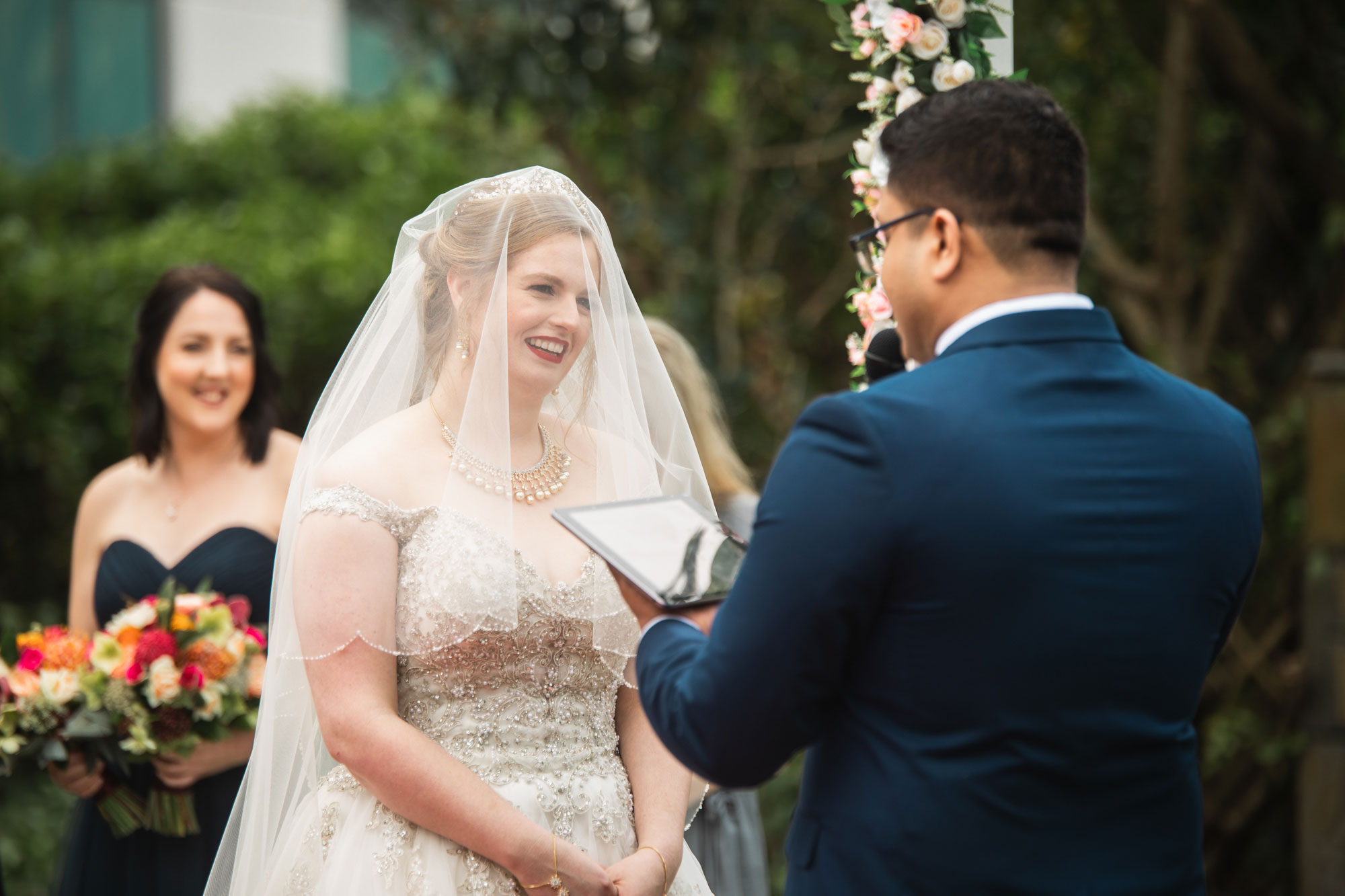 bride looking at groom during wedding vows