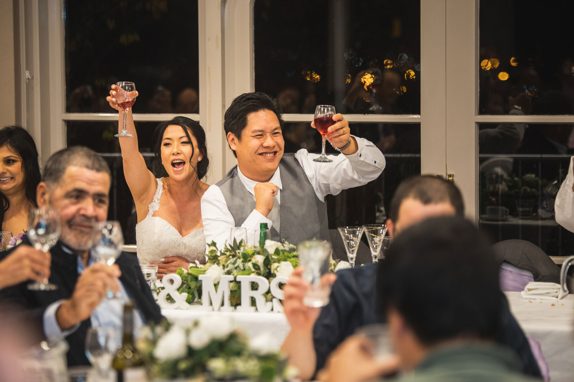 bride and groom giving a toast