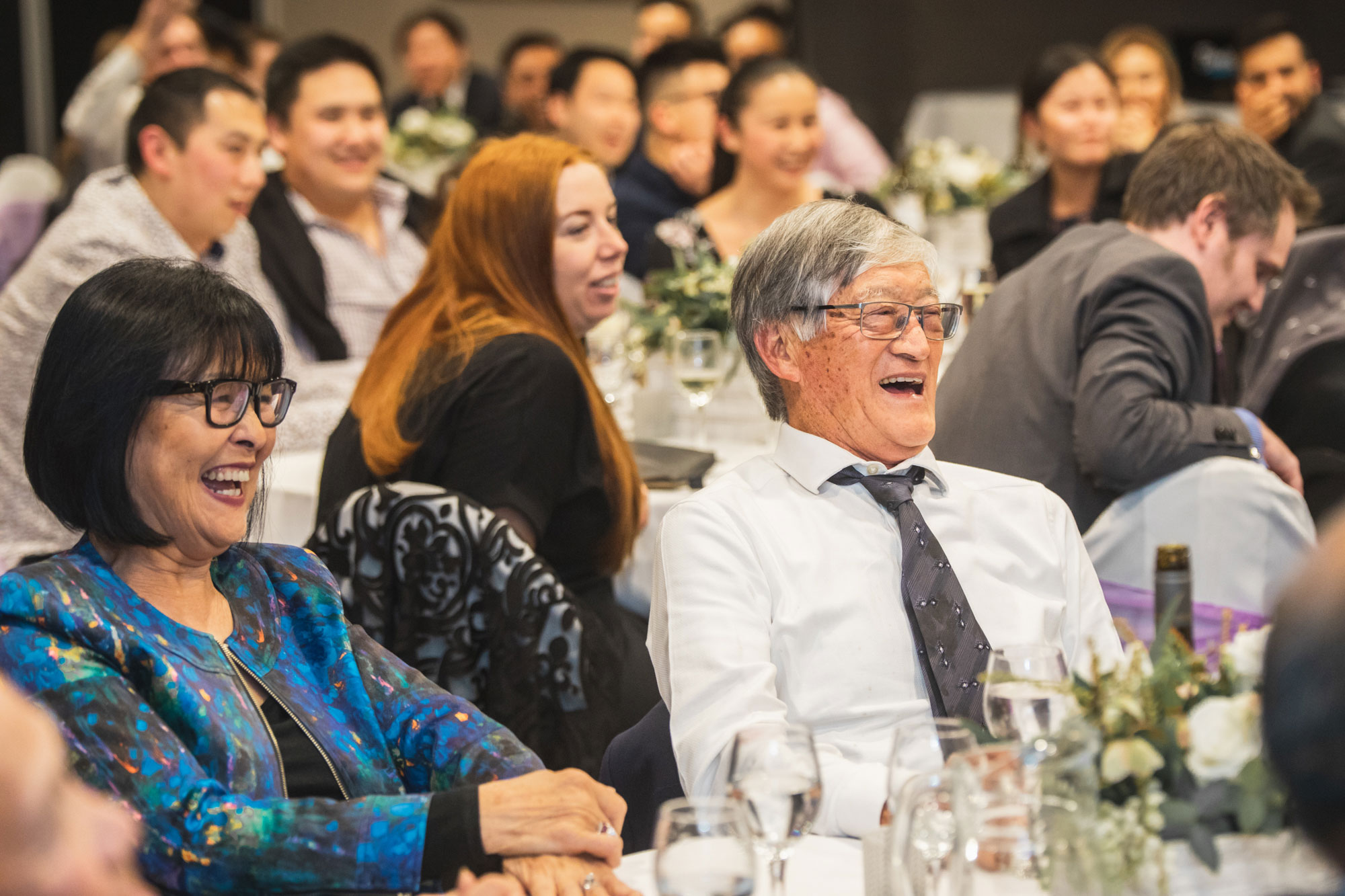 wedding guests laughing at sorrento auckland