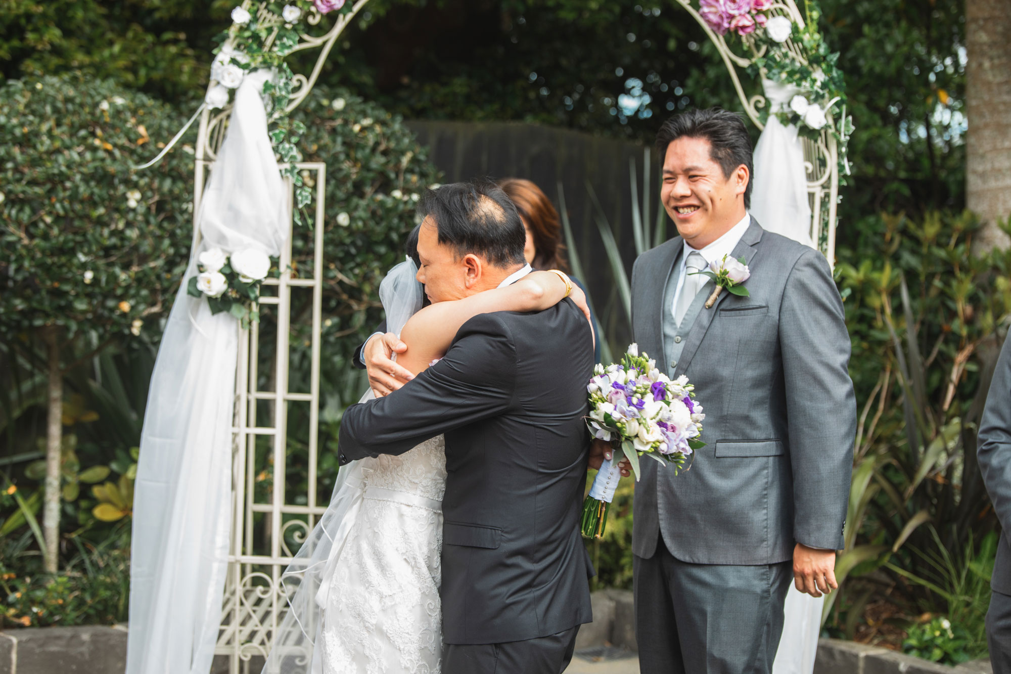 bride and father embrace