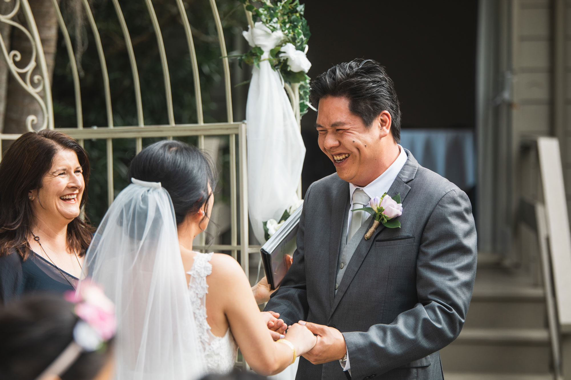 groom happily smiling at the wedding
