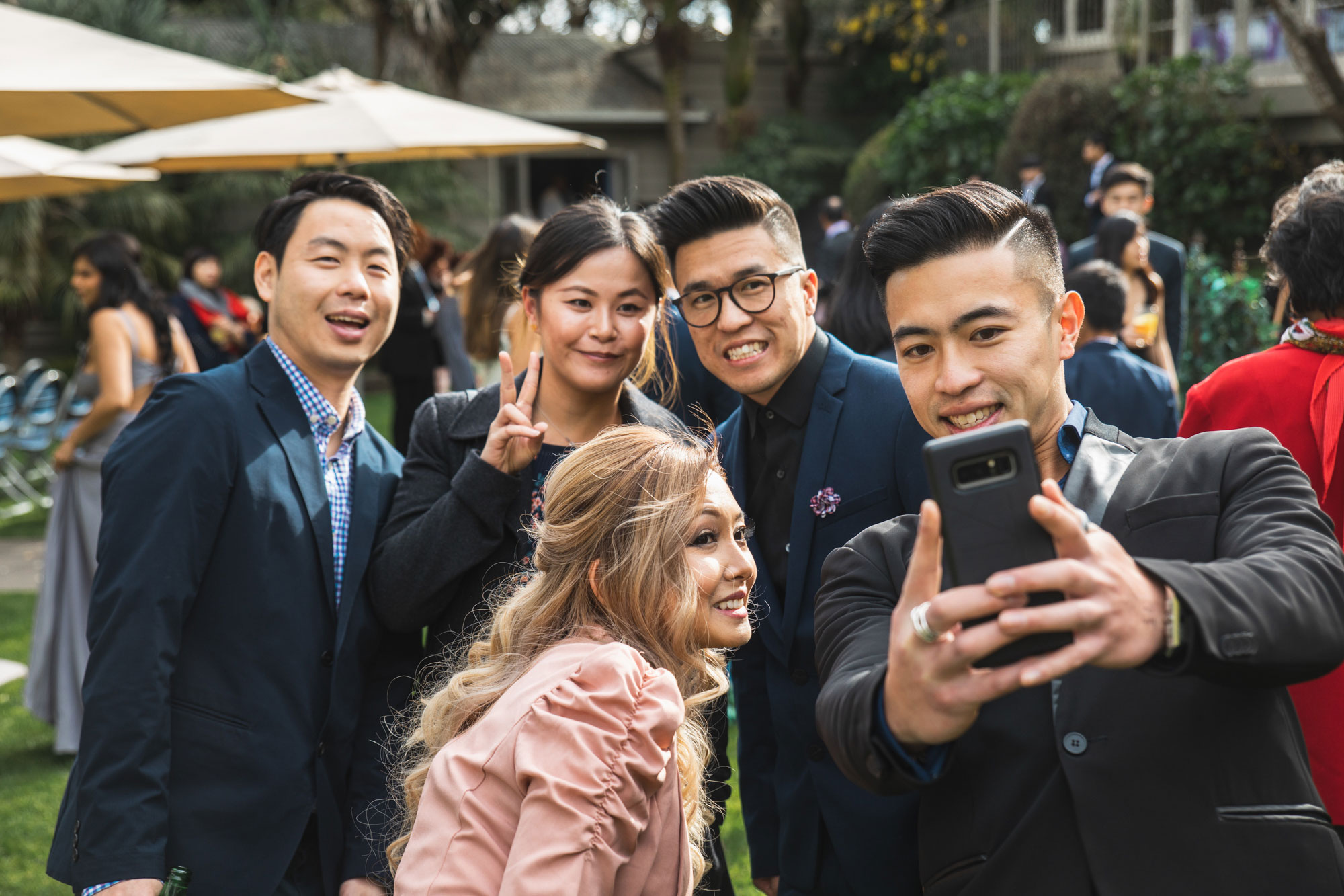 wedding guests taking a selfie