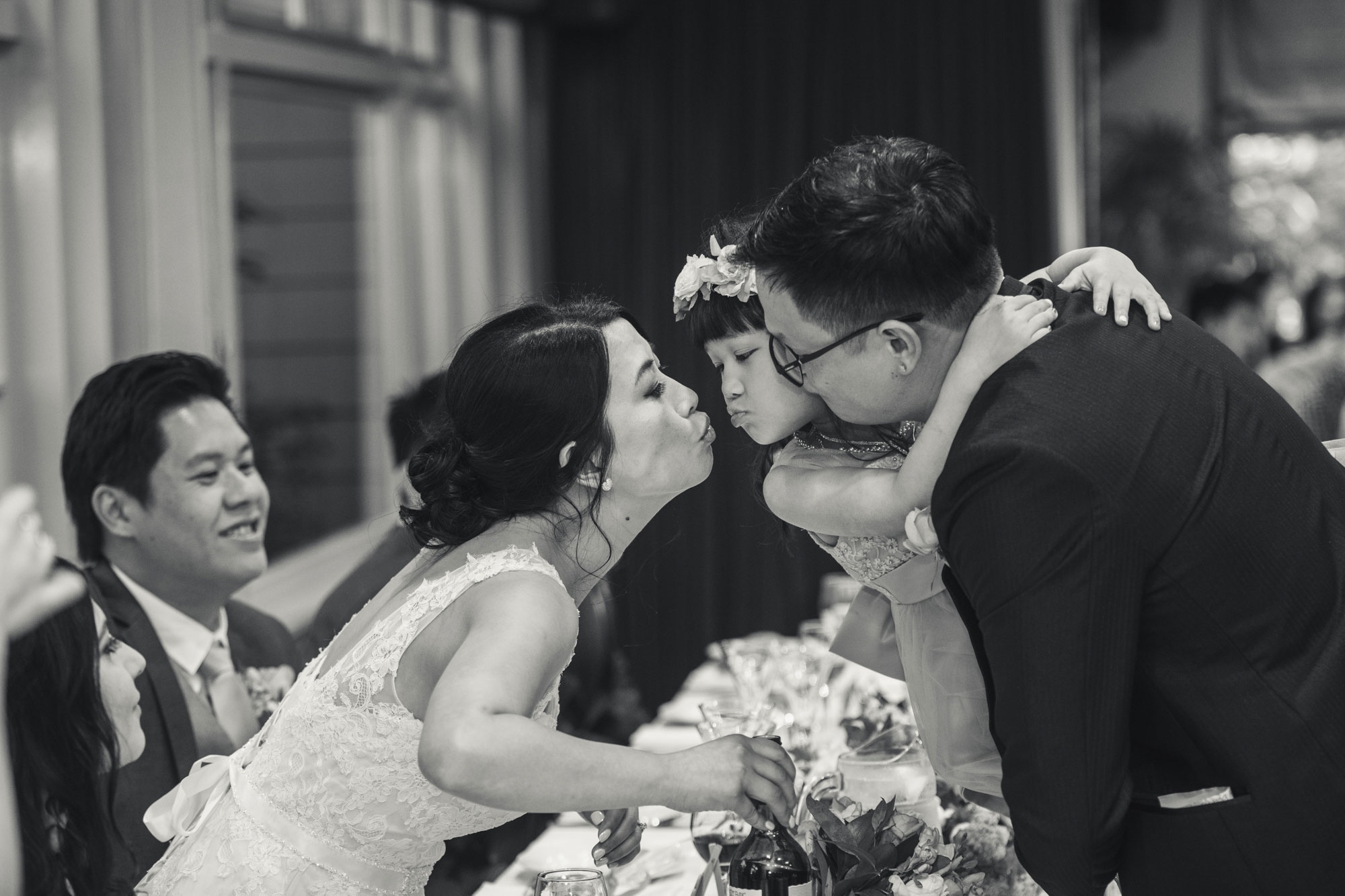 bride kissing little girl