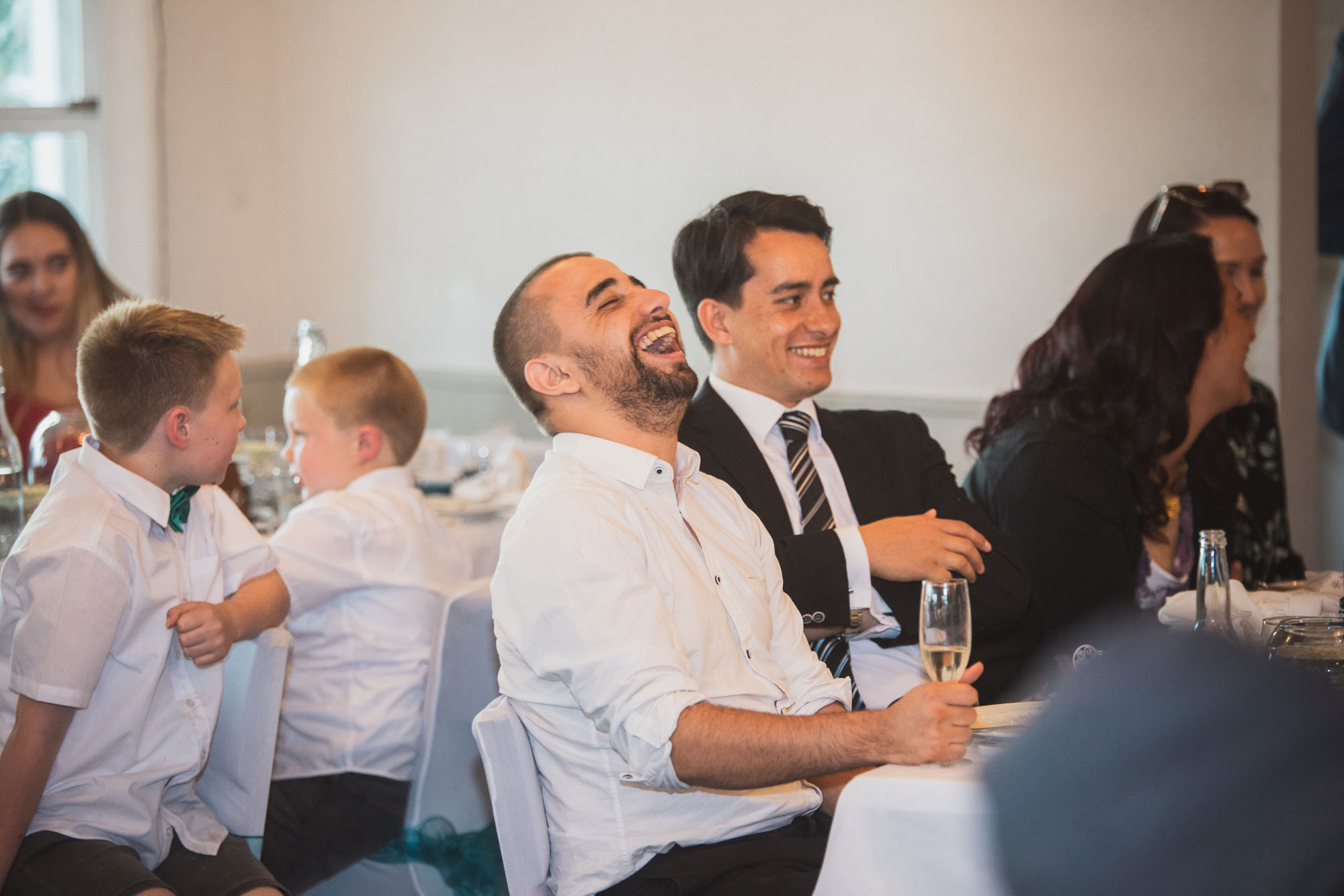 auckland wedding guest having a laugh