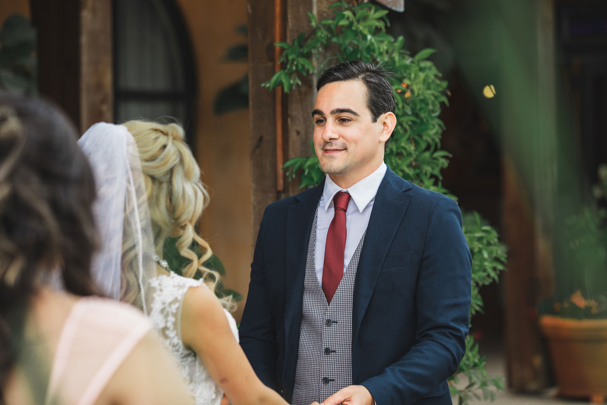 auckland wedding groom smiling at bride