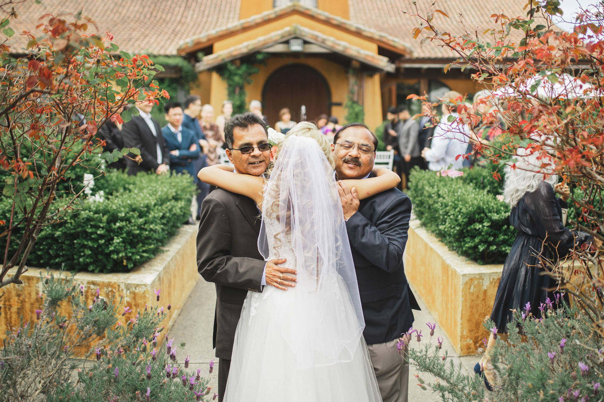 auckland wedding bride hug guests